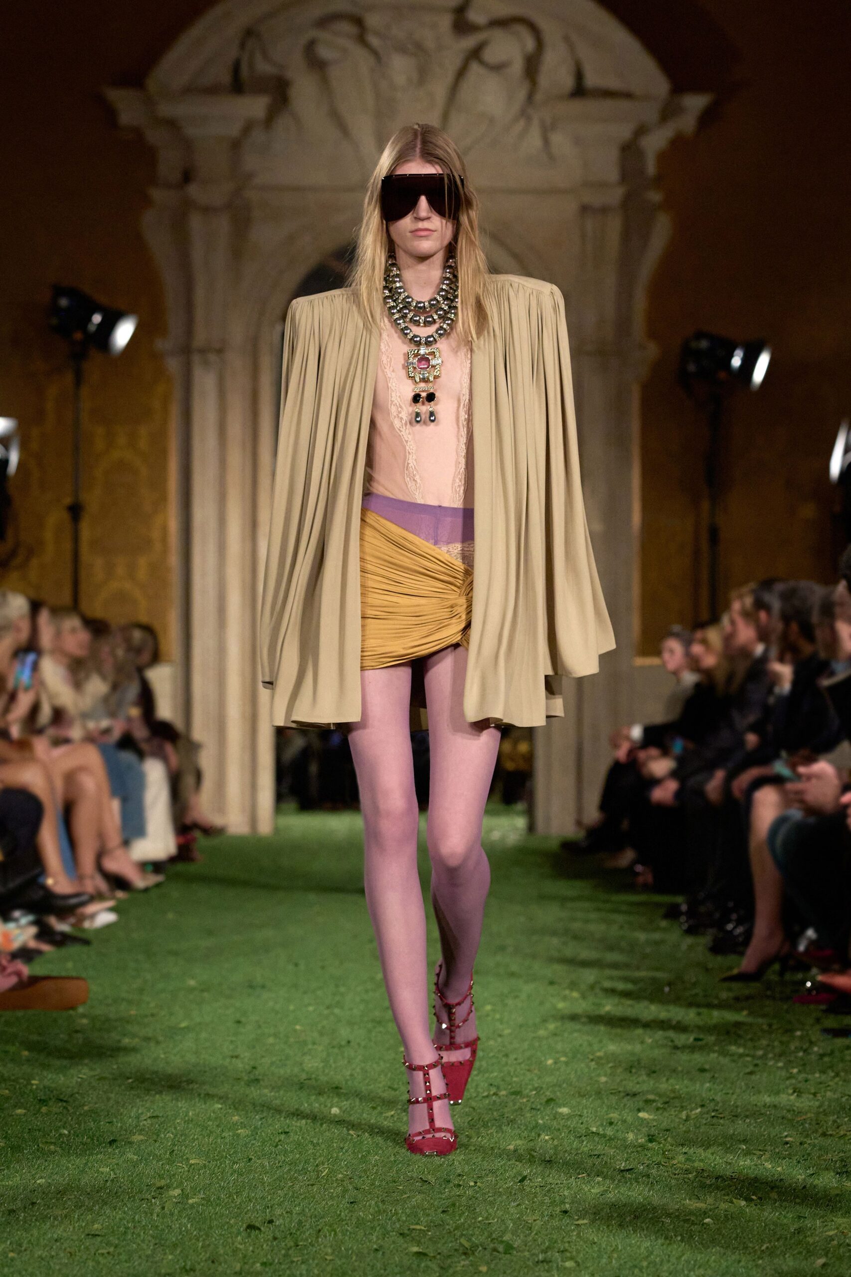 beige cape yellow skirt red shoes