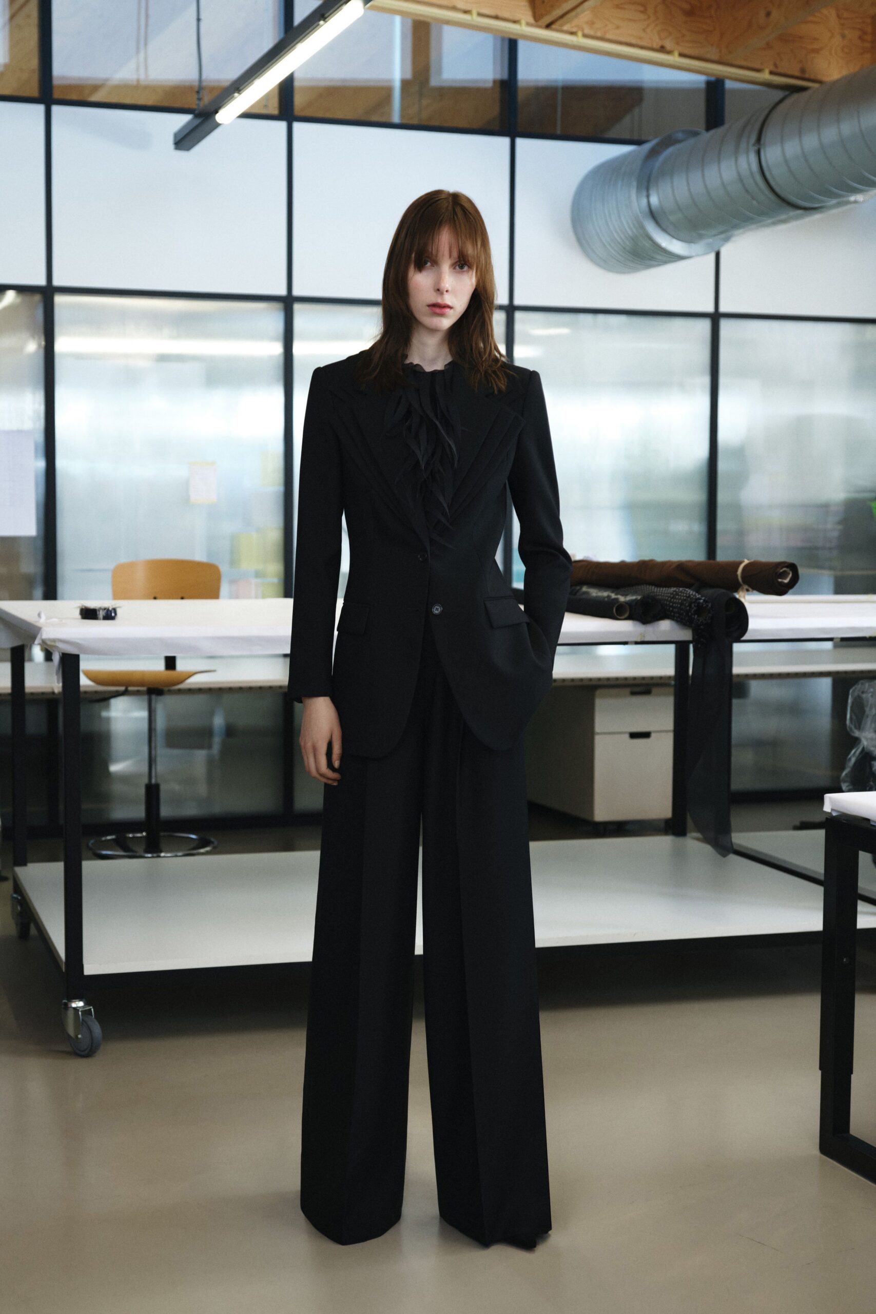 black wool long-sleeve collared tailored pleated suit