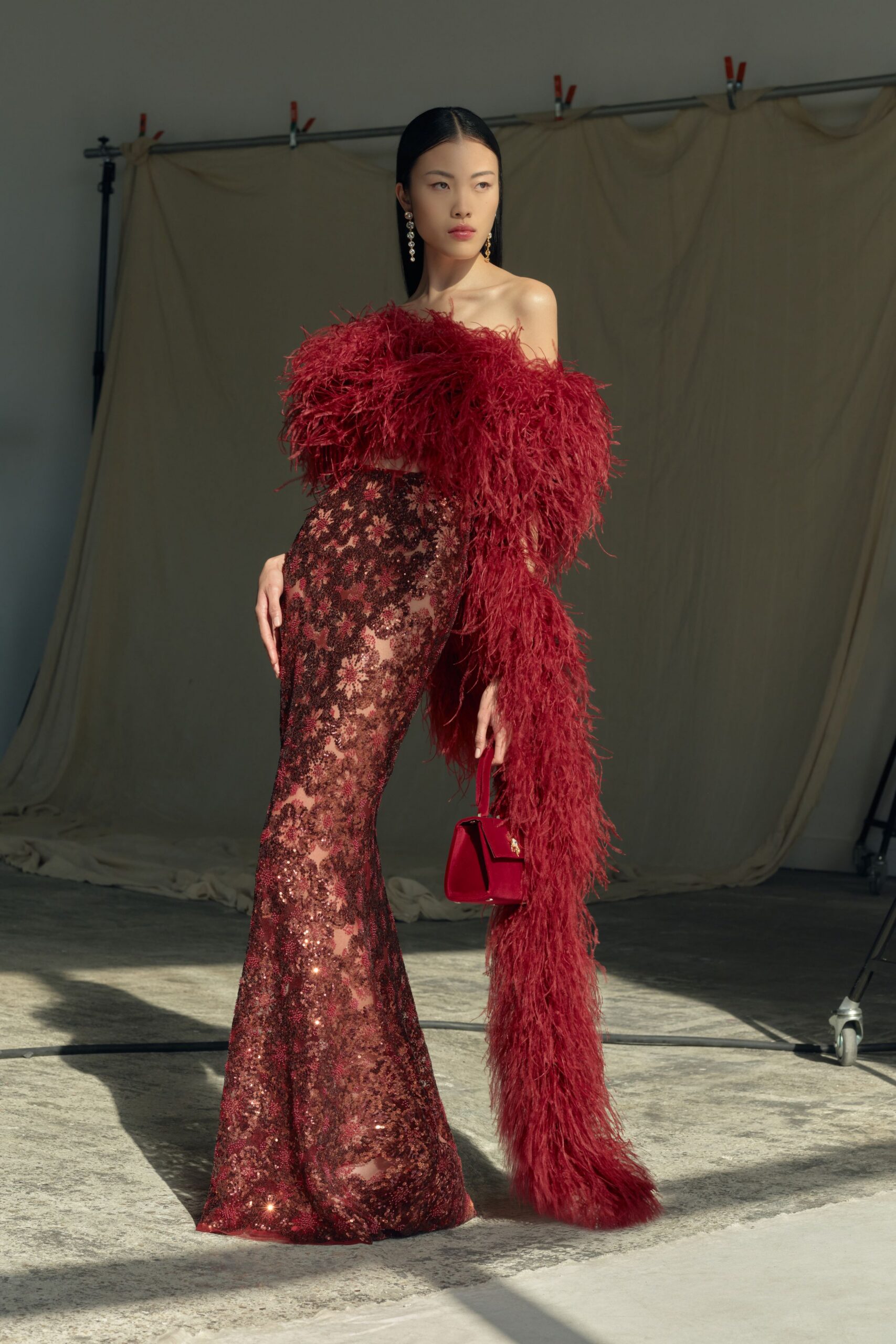 red silk strapless fitted sequined tiered shiny gown