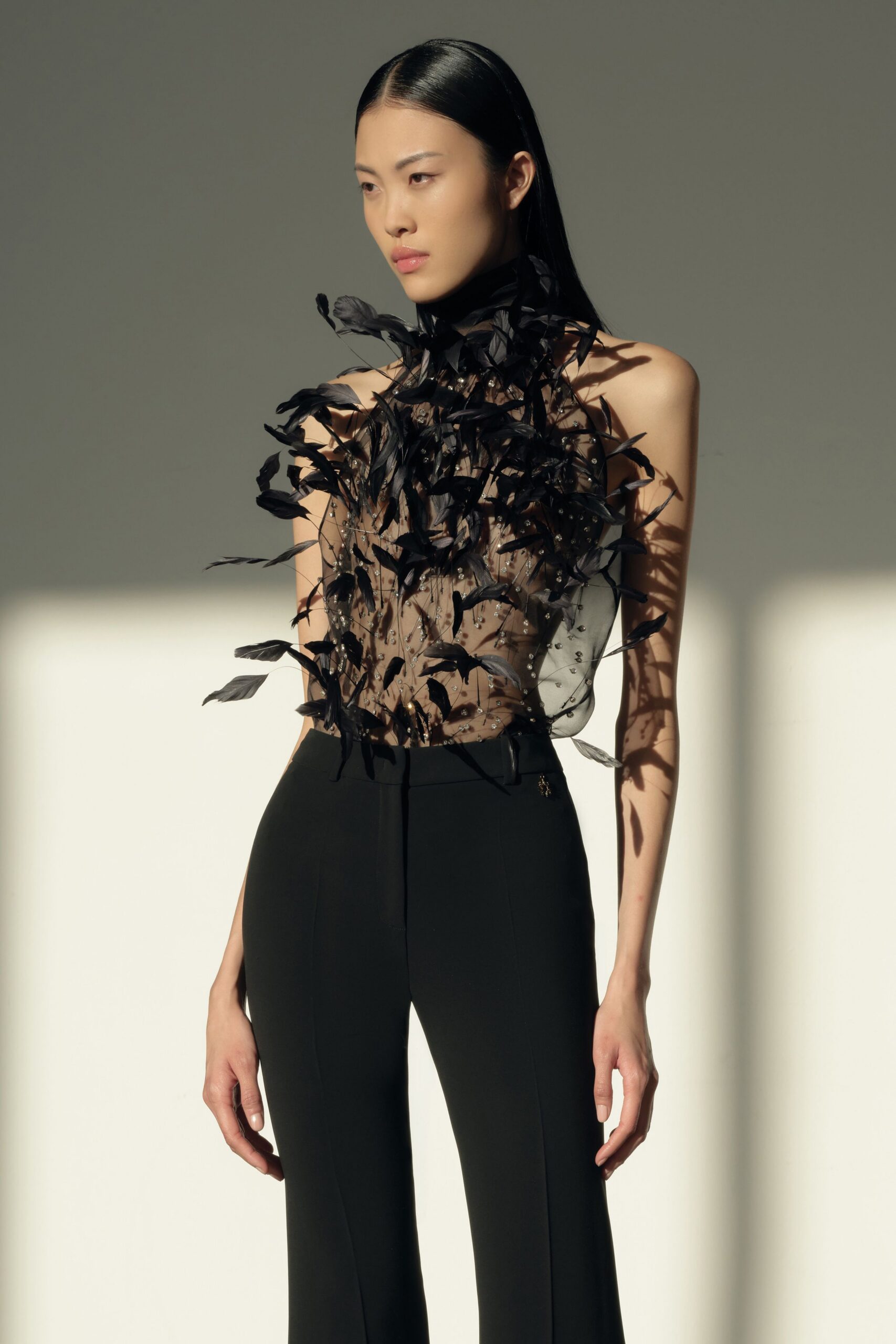 black silk sleeveless high-neck fitted layered ruffled top