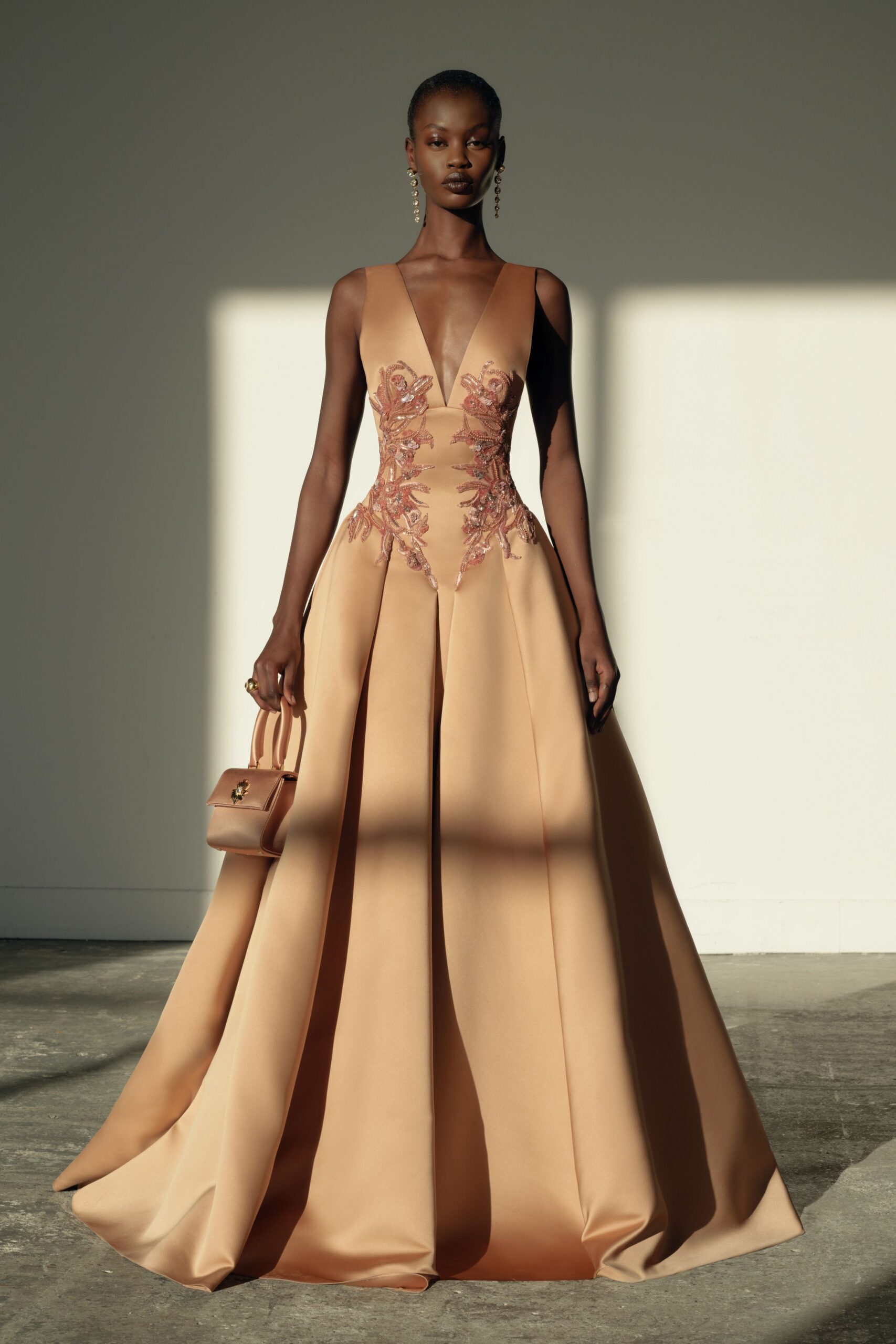 beige silk sleeveless v-neck fitted embroidered a-line gown