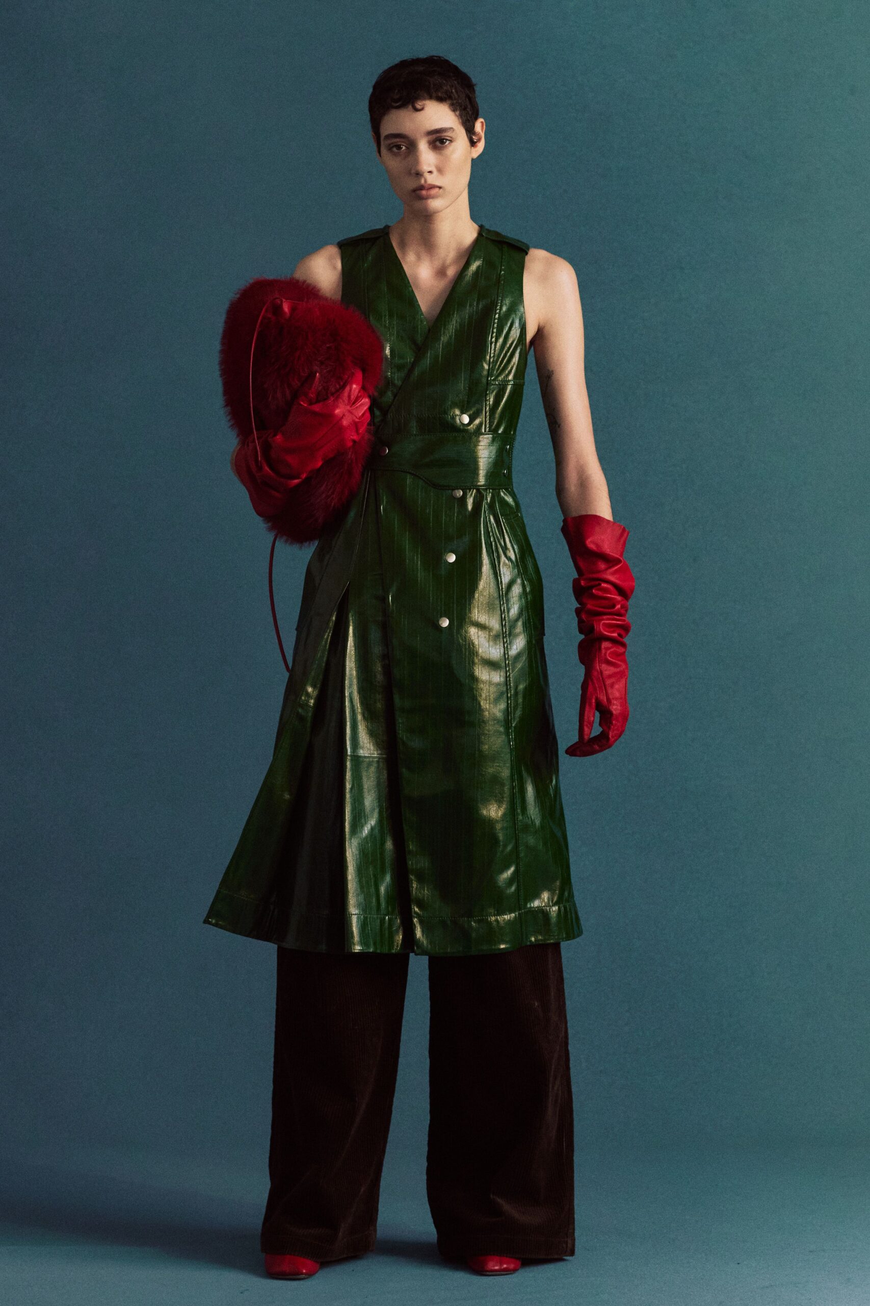 green leather sleeveless v-neck fitted buttoned pleated dress