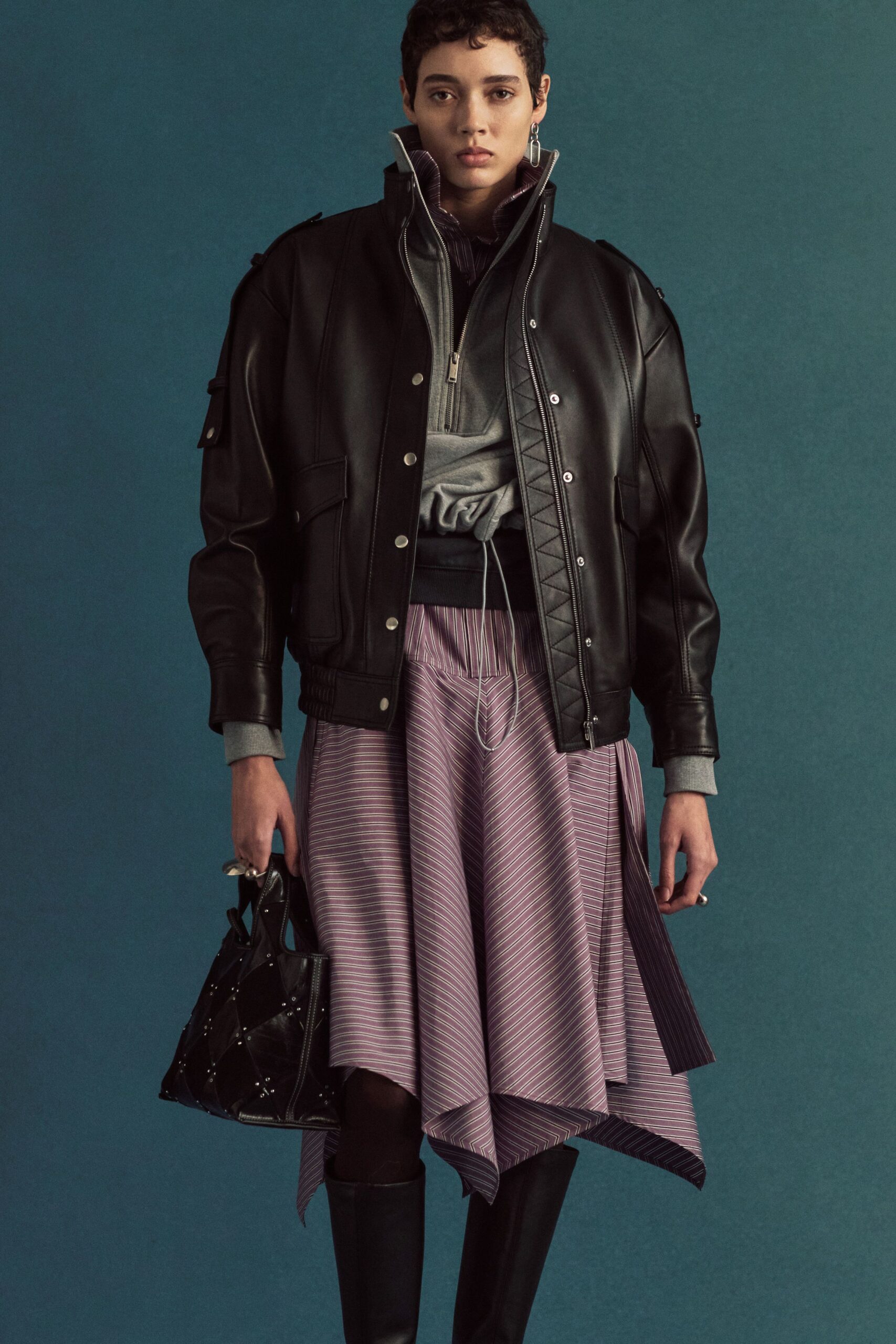 black leather jacket with purple skirt