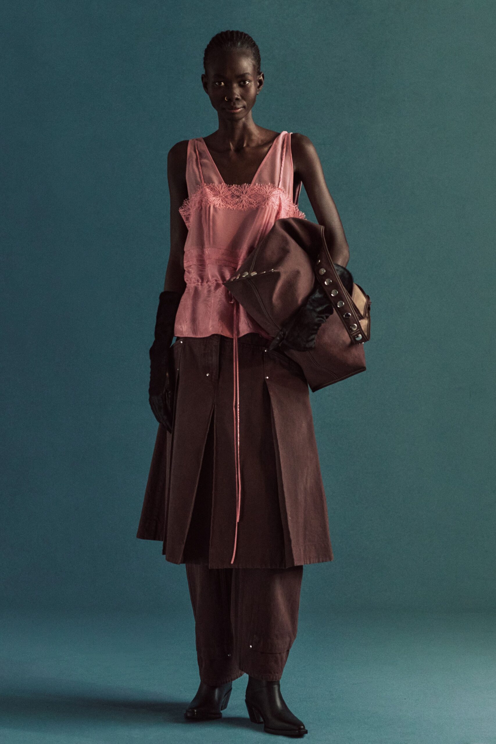 pink silk ruffled top with brown denim skirt