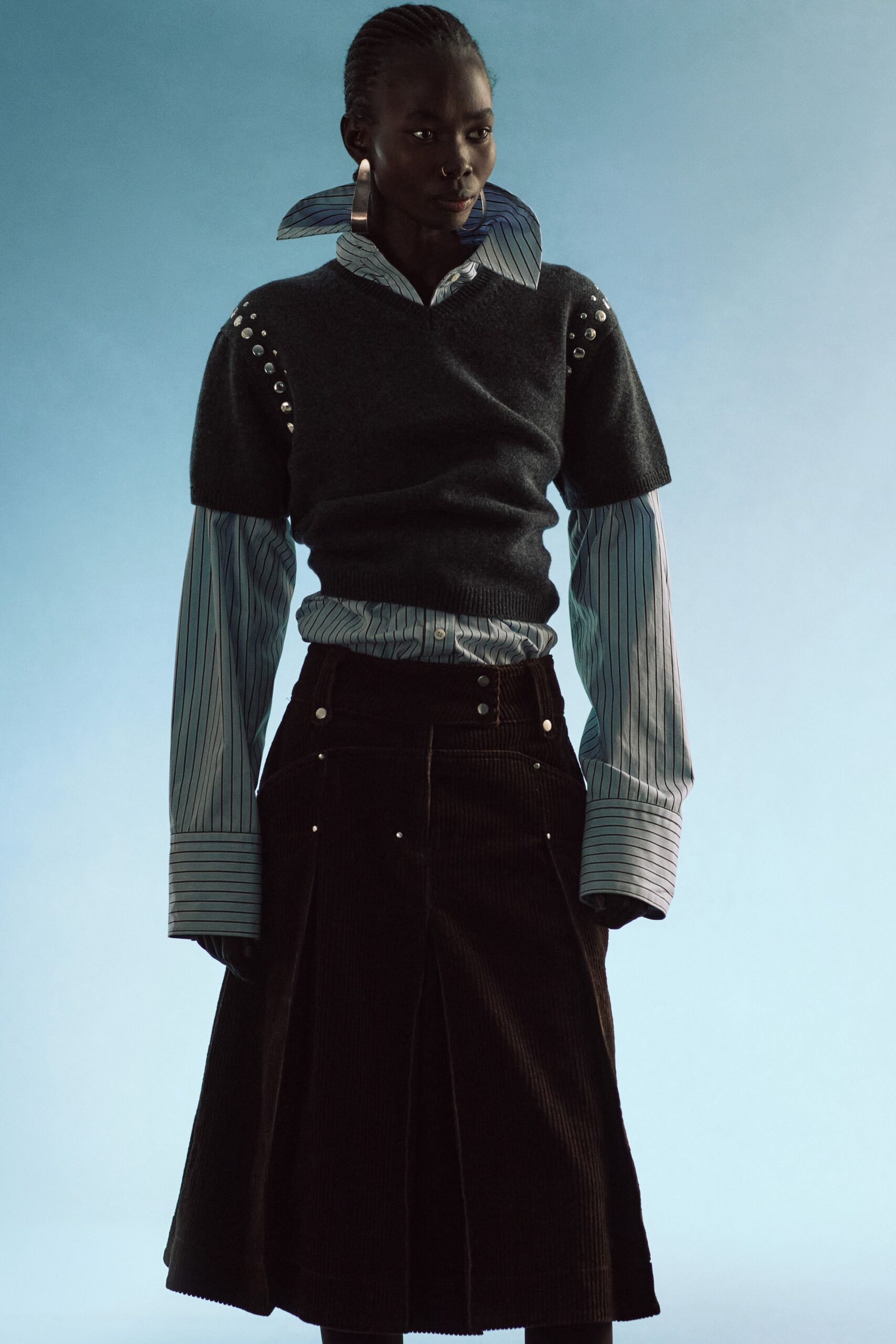 gray wool fitted top with collared shirt and brown skirt