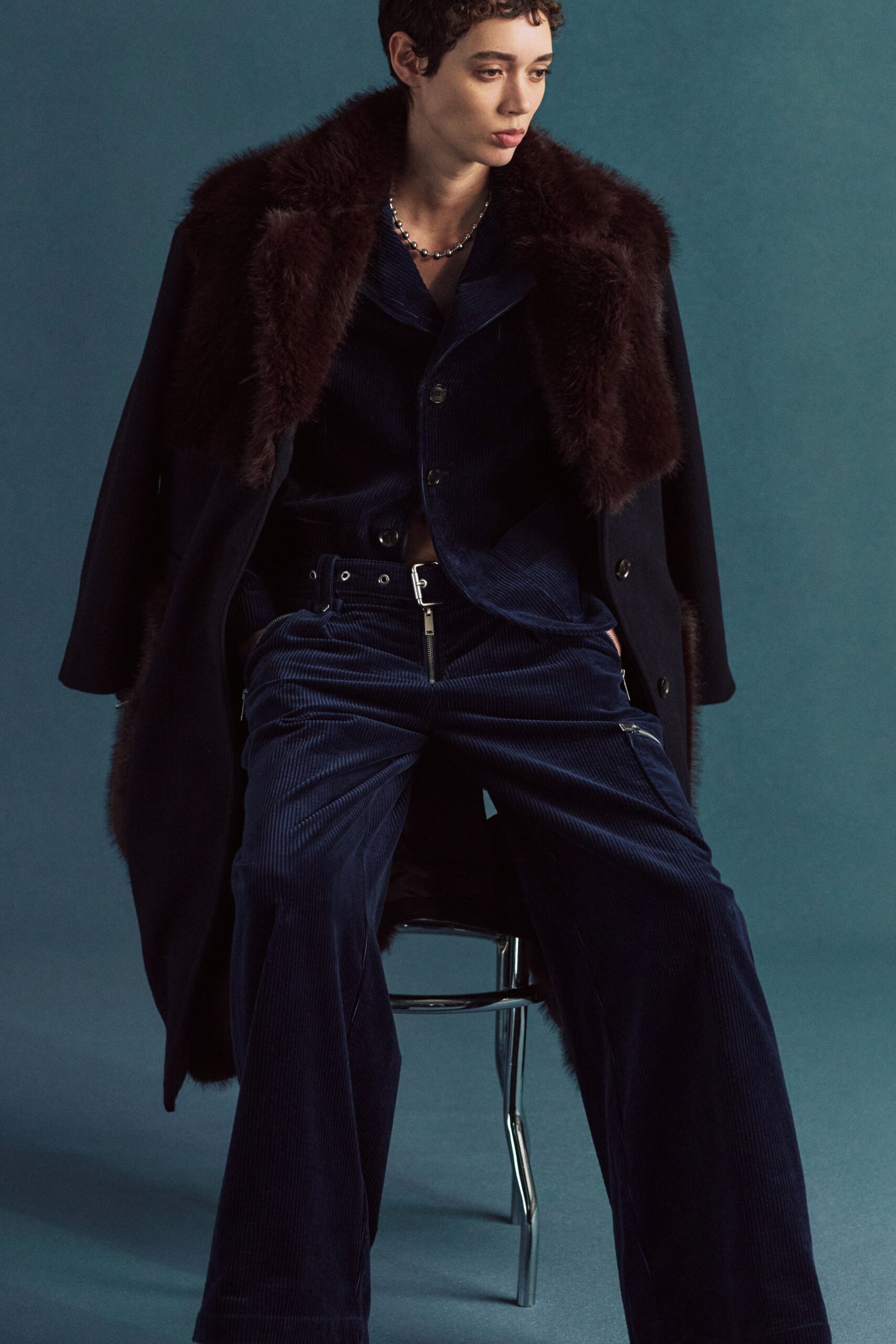 black wool coat with navy shirt and pants
