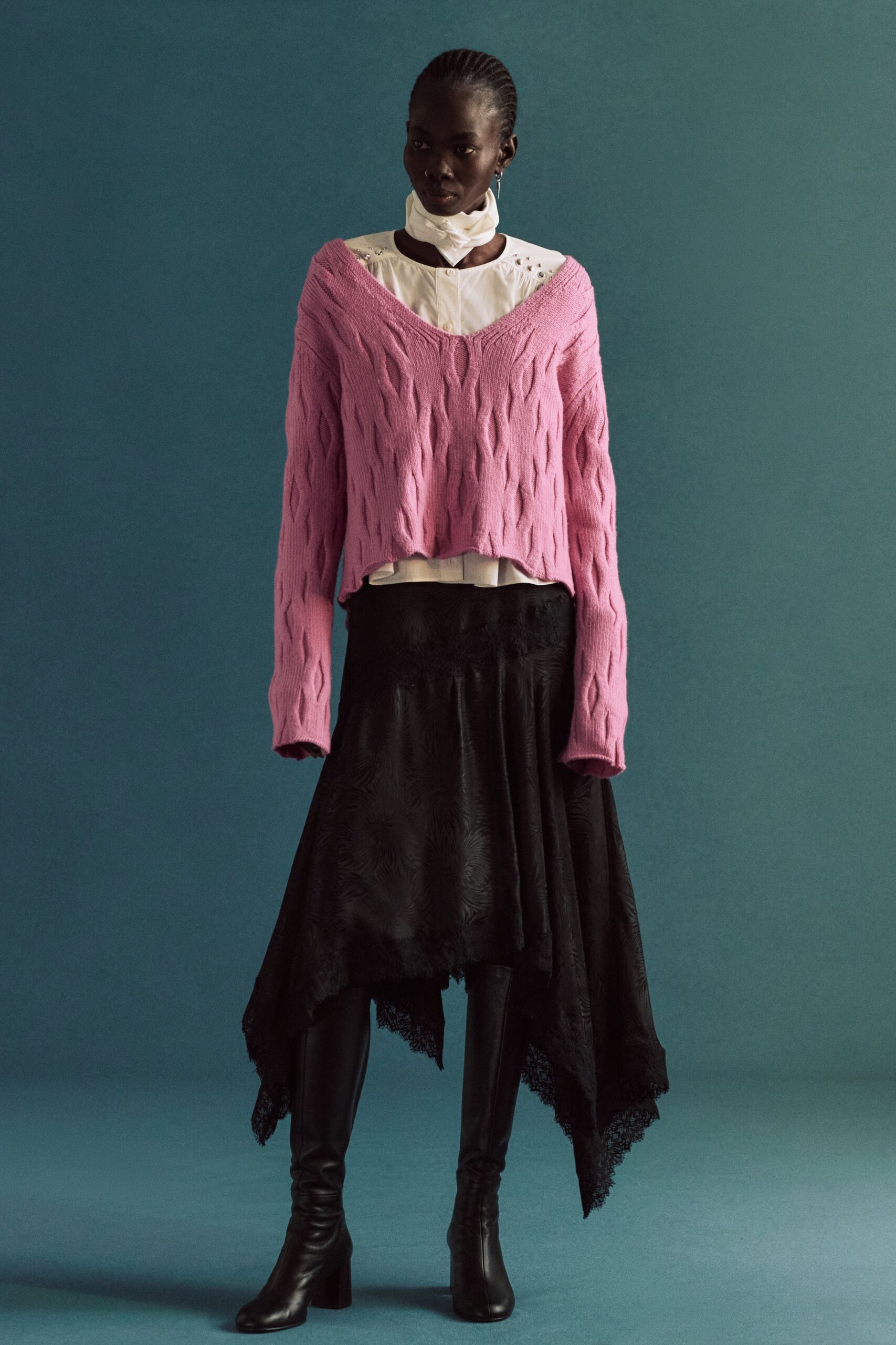 pink wool sweater with black skirt