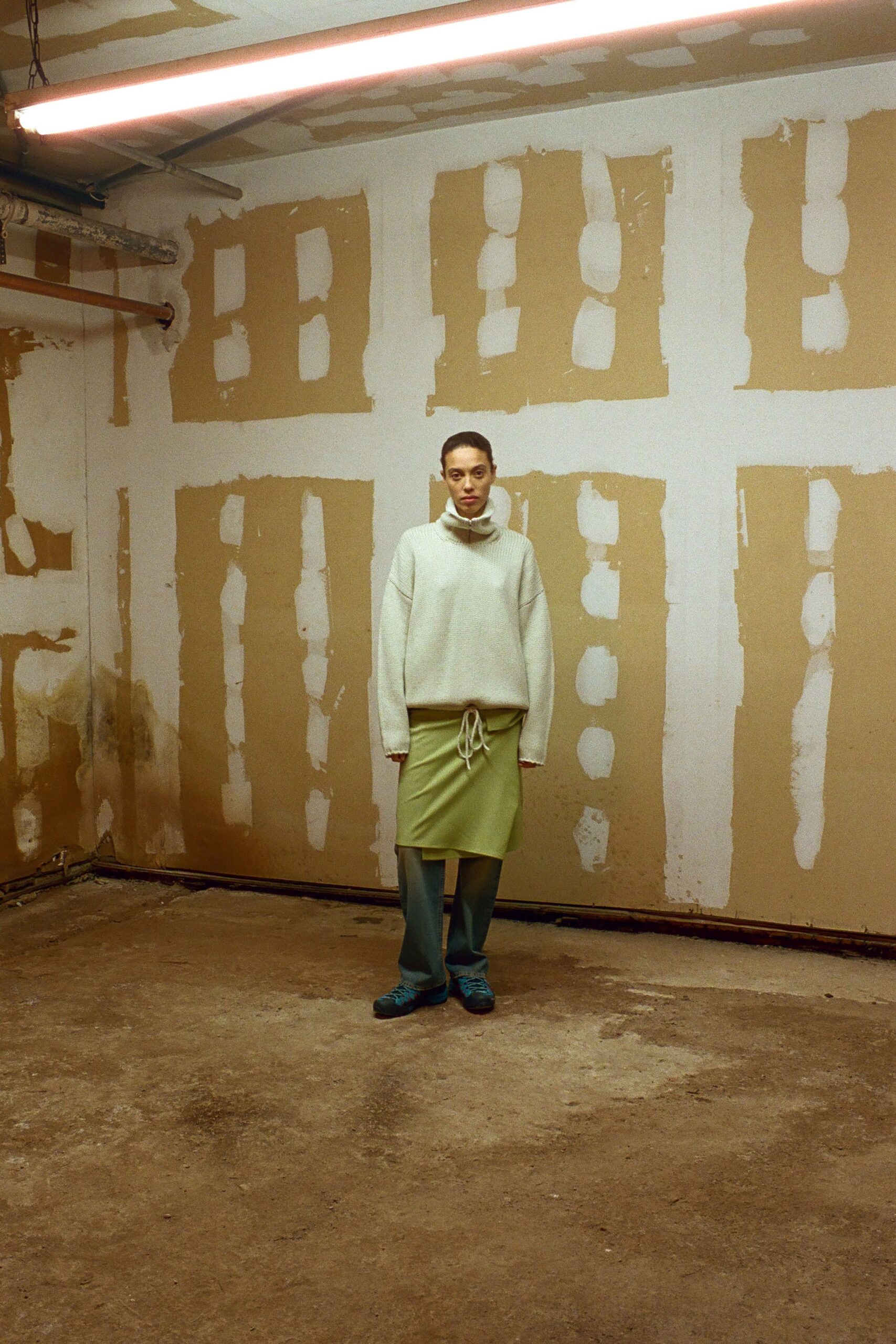 white relaxed sweater green skirt blue pants