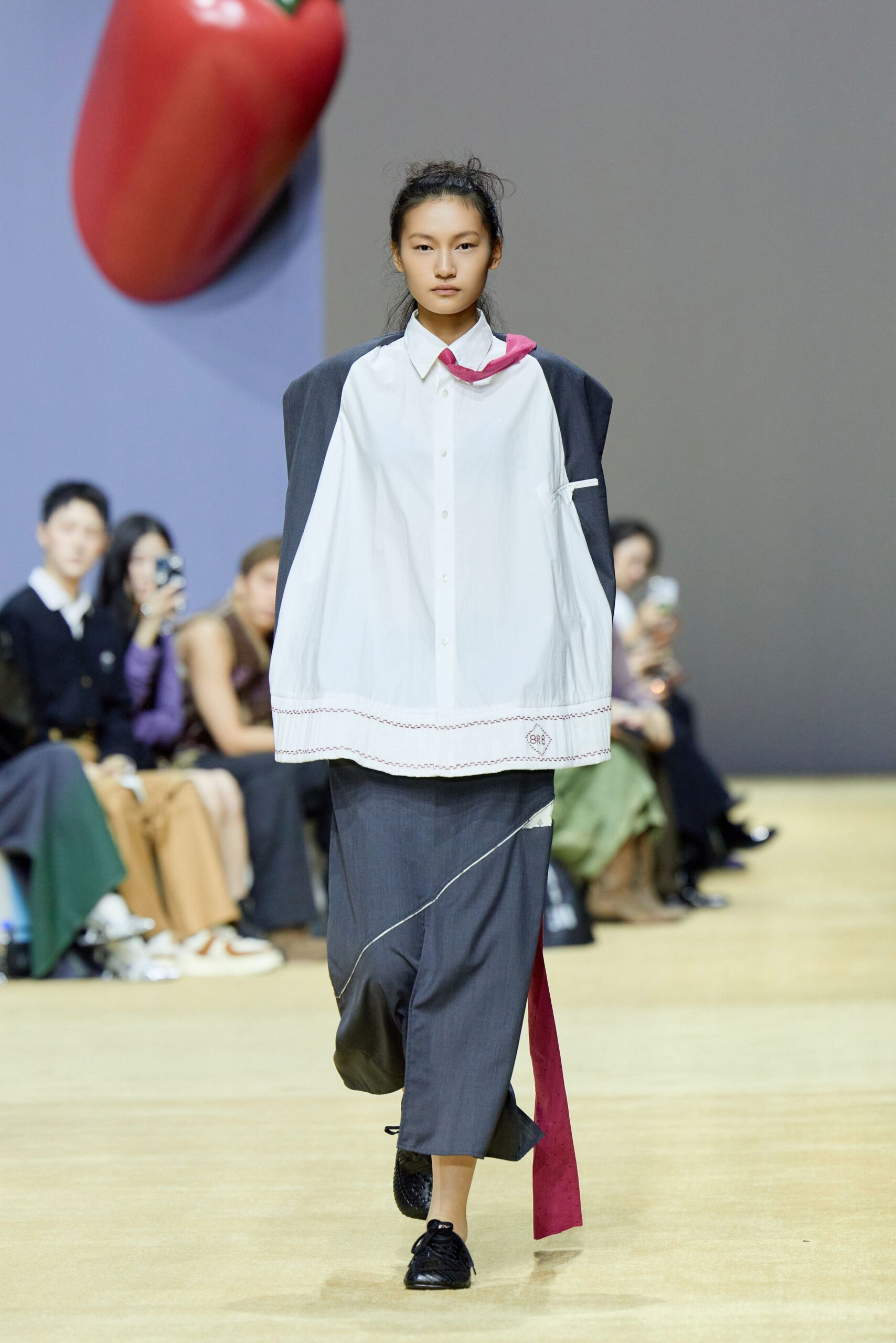white relaxed shirt gray pants