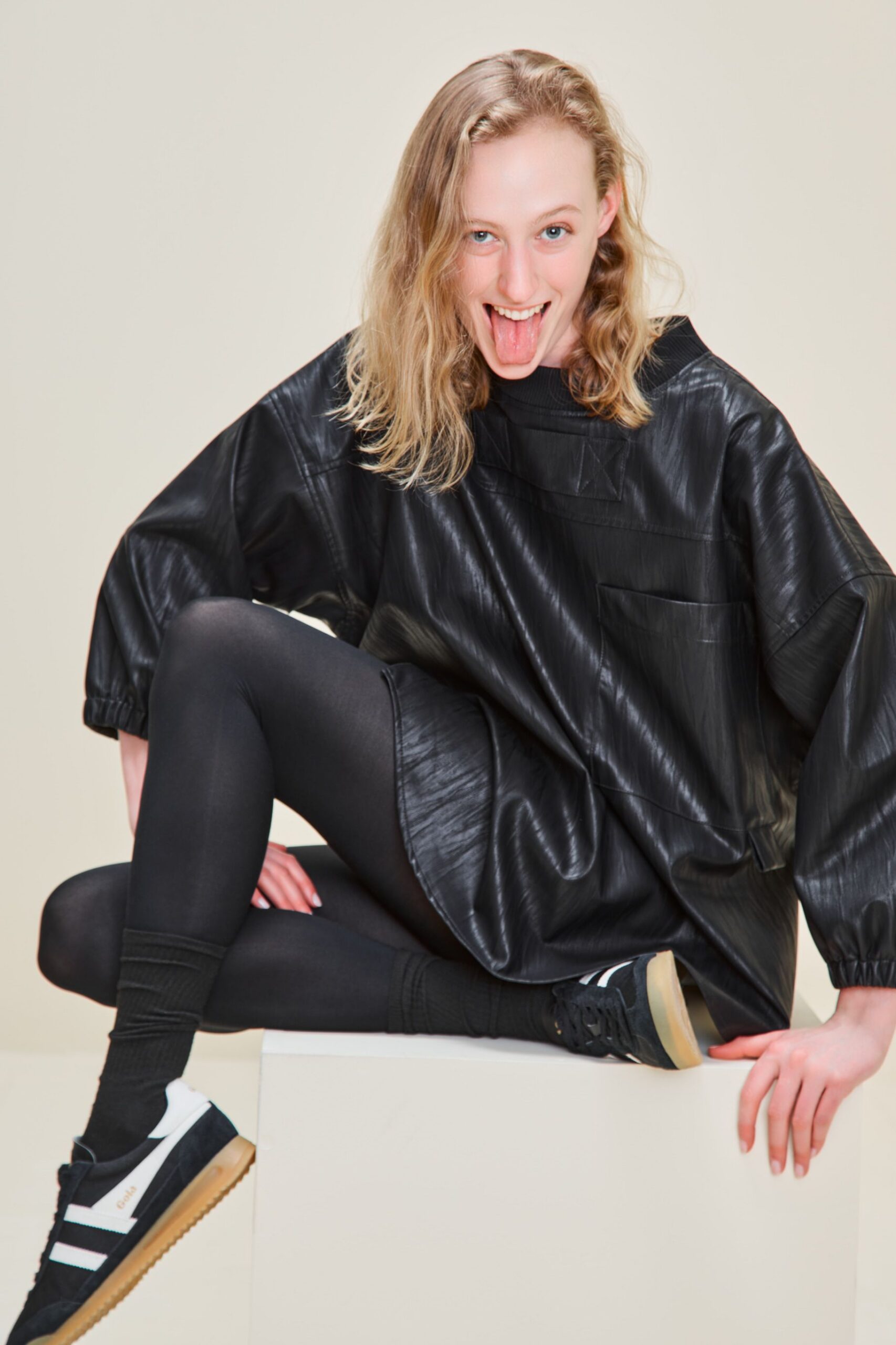 black vinyl long-sleeve collared oversized pleated short top