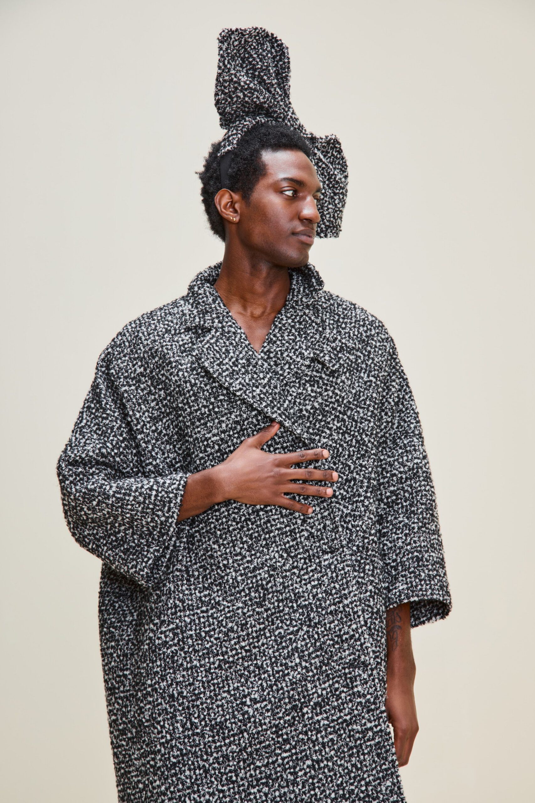 black wool long-sleeve collared oversized textured coat