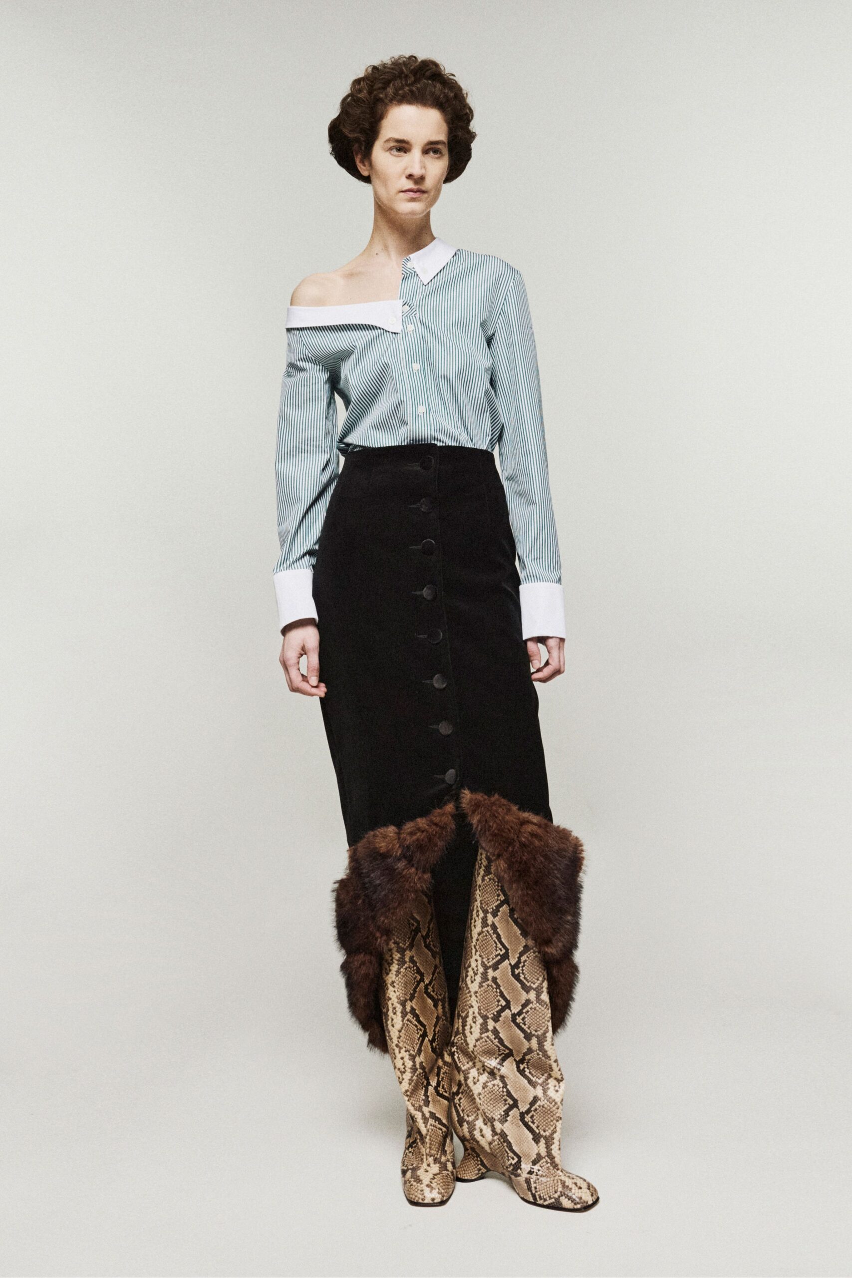 blue striped shirt black skirt animal-print boots