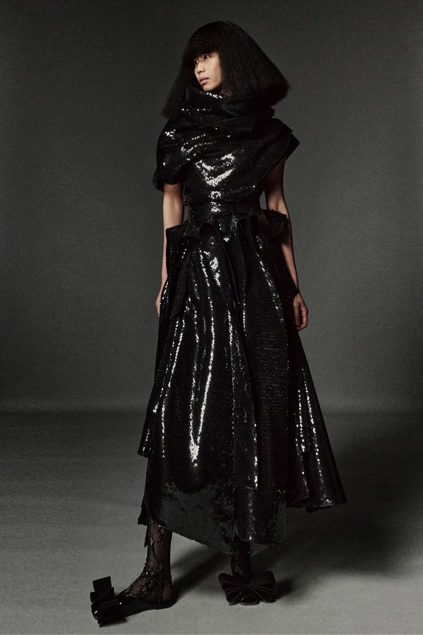 black silk sleeveless high-neck fitted pleated layered gown