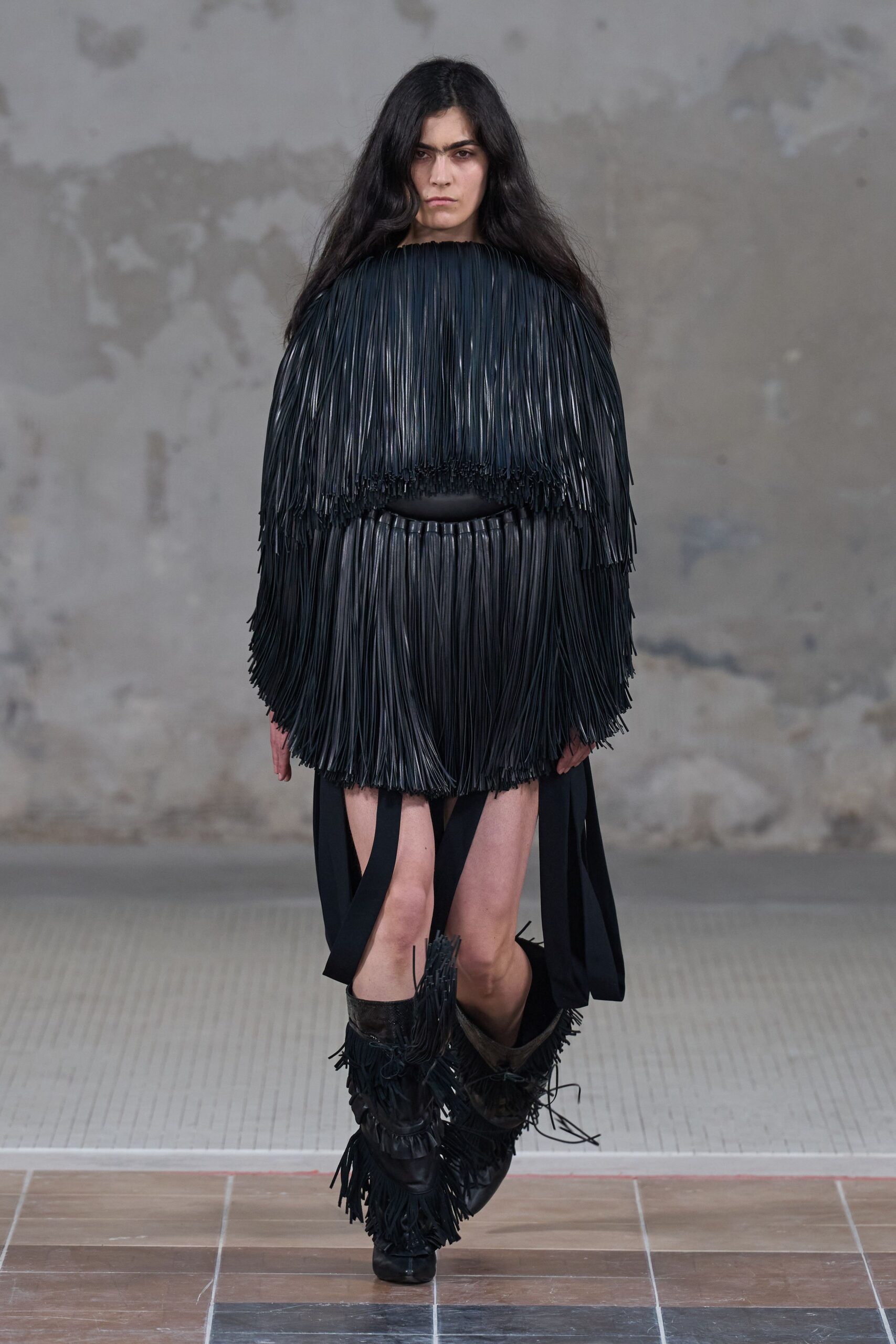 black leather sleeveless v-neck fitted fringed mini dress
