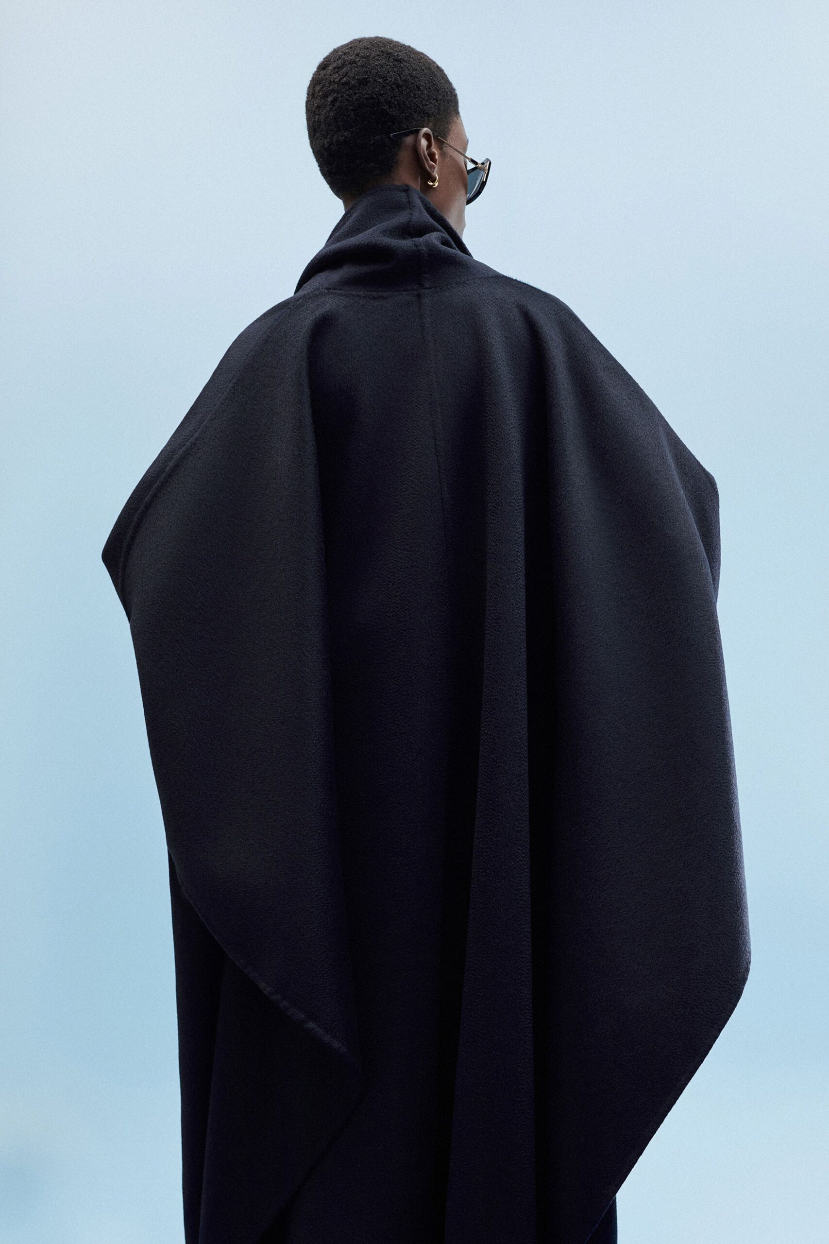 black wool cape with sunglasses