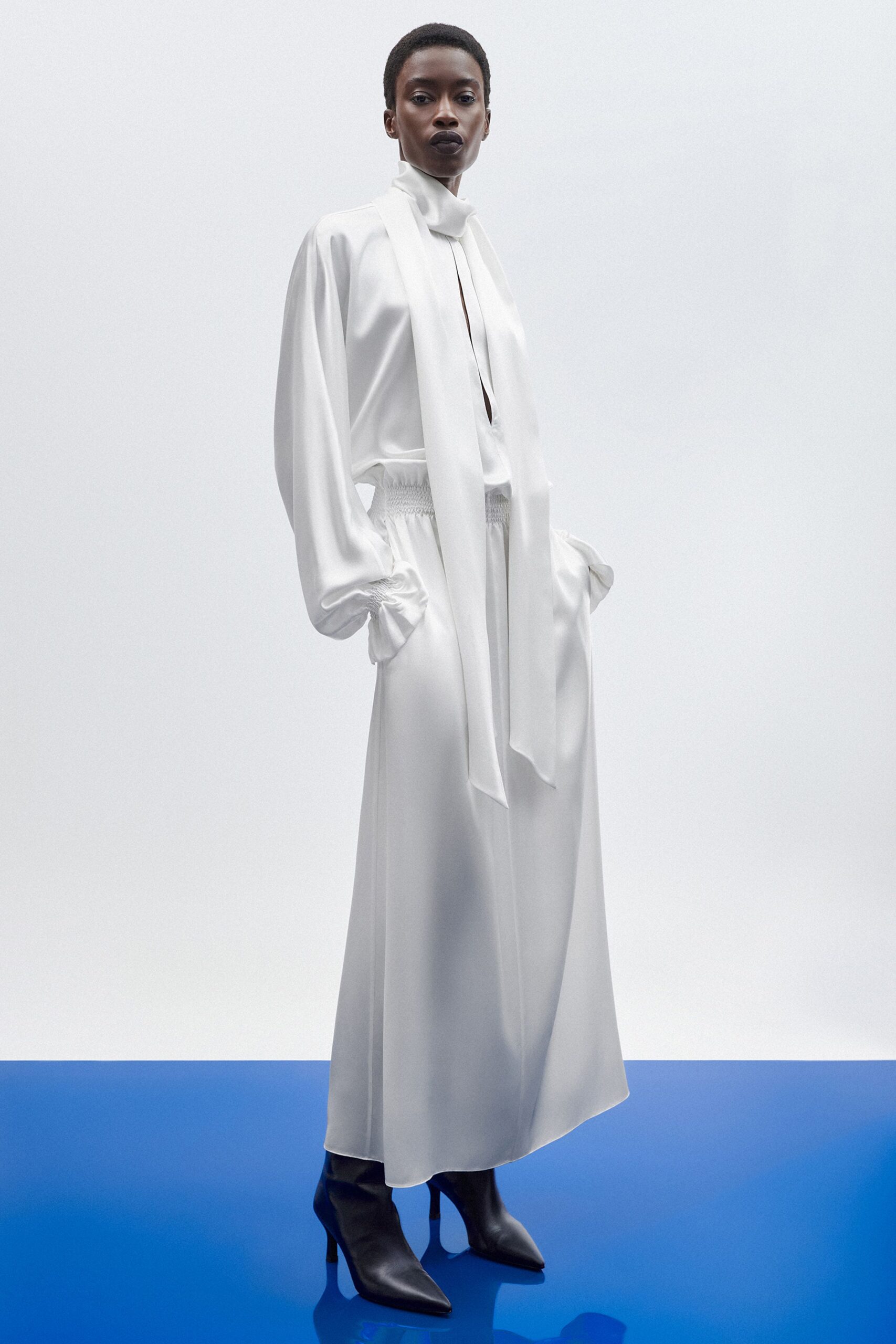 white silk long-sleeve collared relaxed pleated flowing dress