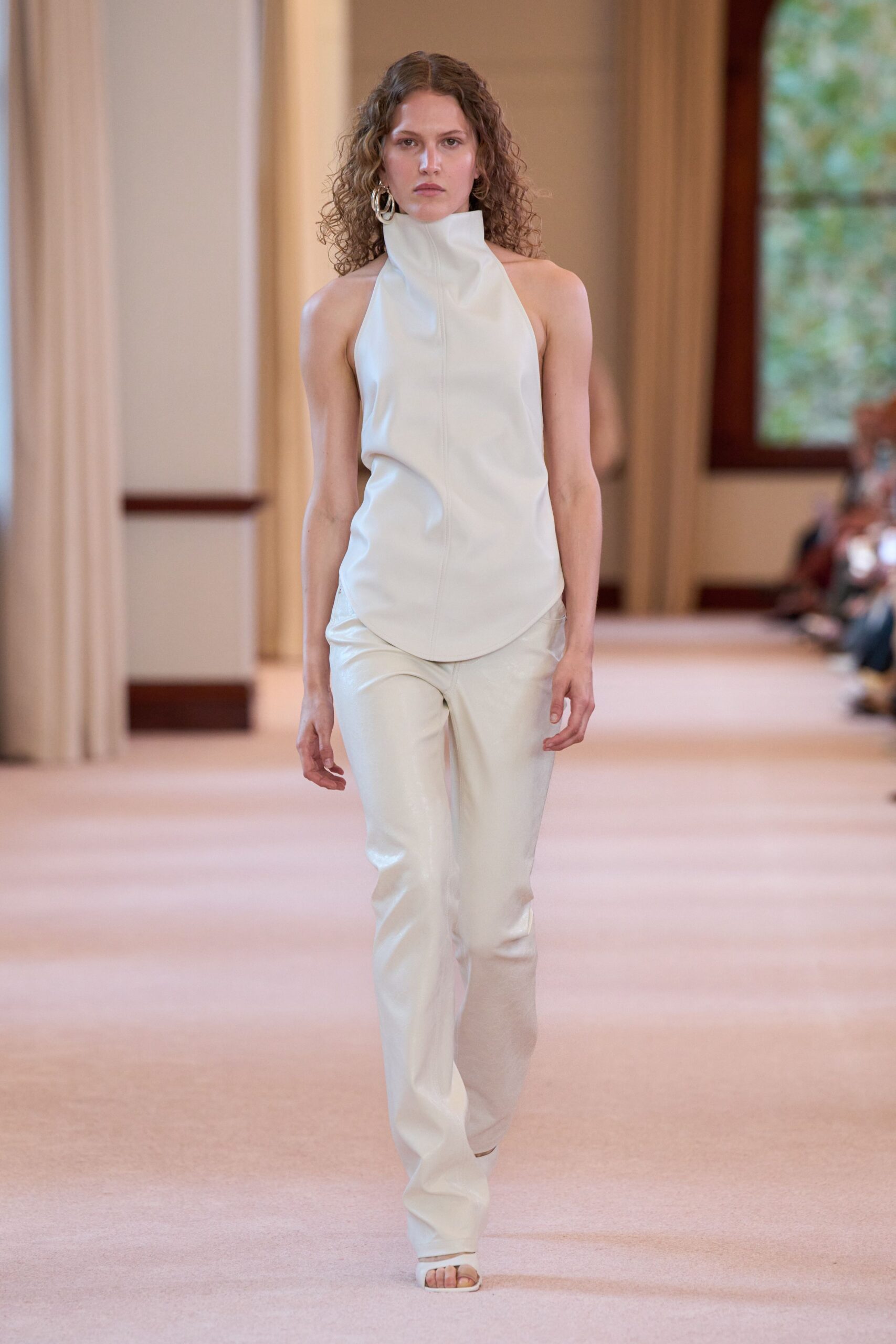 white leather sleeveless high-neck fitted top