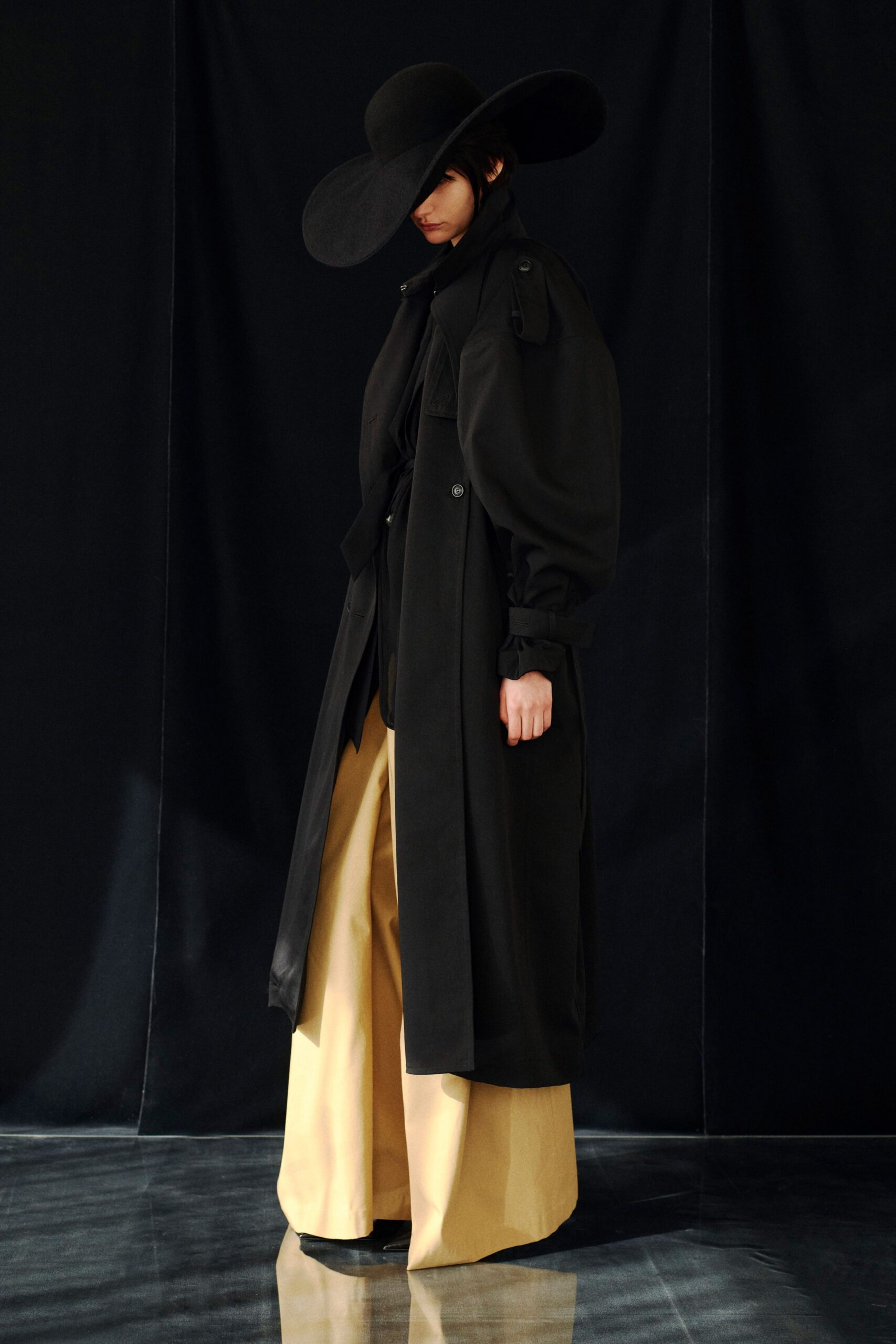black wool coat beige wide-leg pants