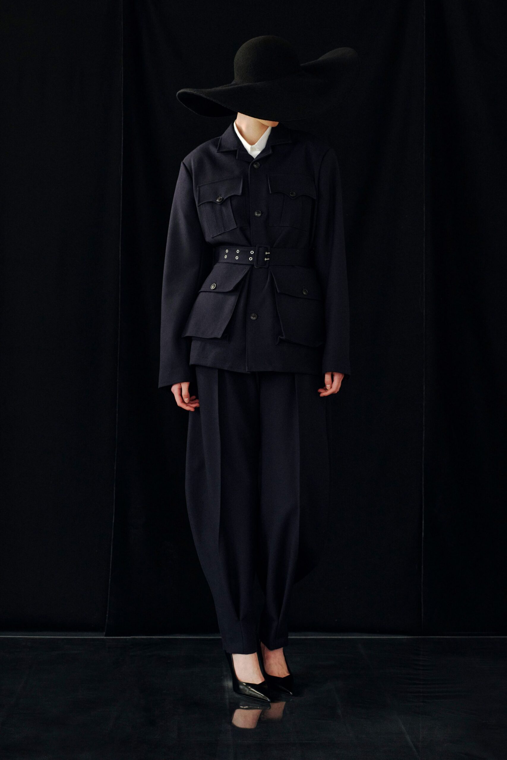 black cotton long-sleeve collared structured buttoned zippered jacket