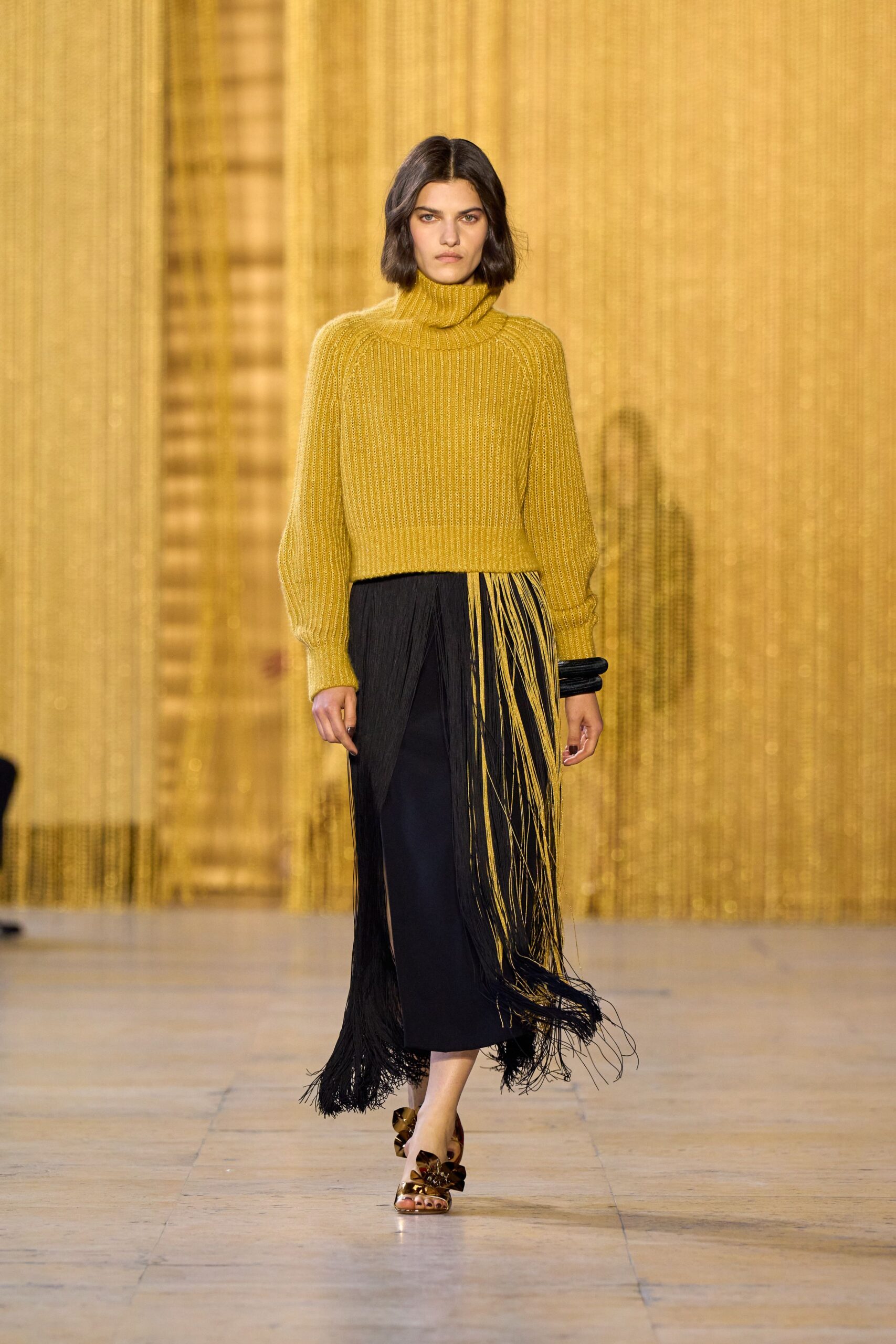 yellow wool relaxed sweater with fringed black skirt
