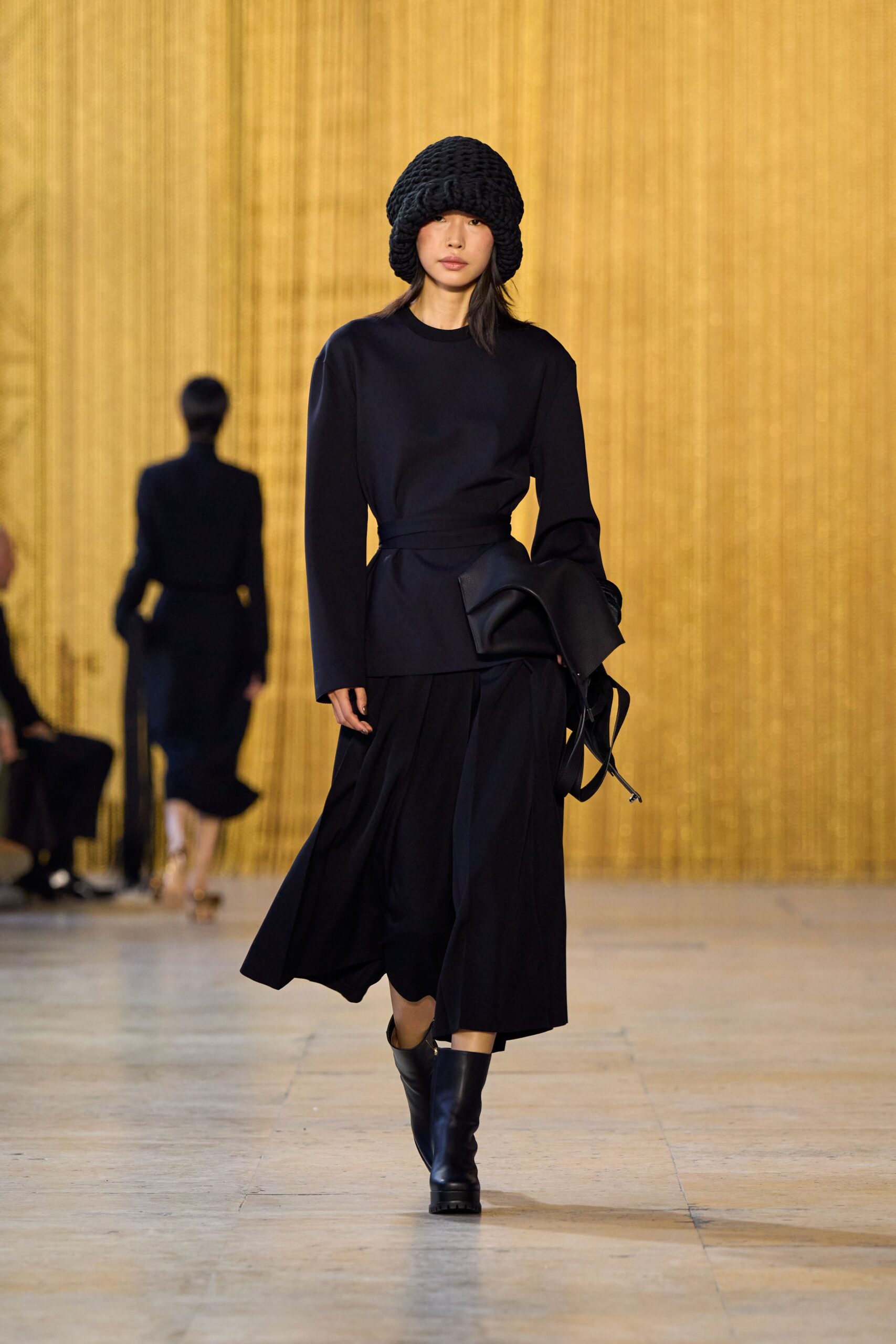 black fitted top with pleated midi skirt