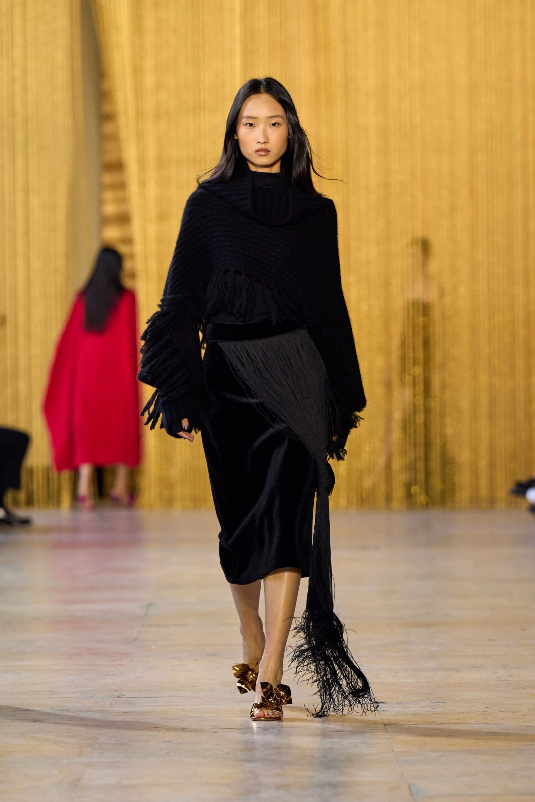 black knit top and pleated skirt