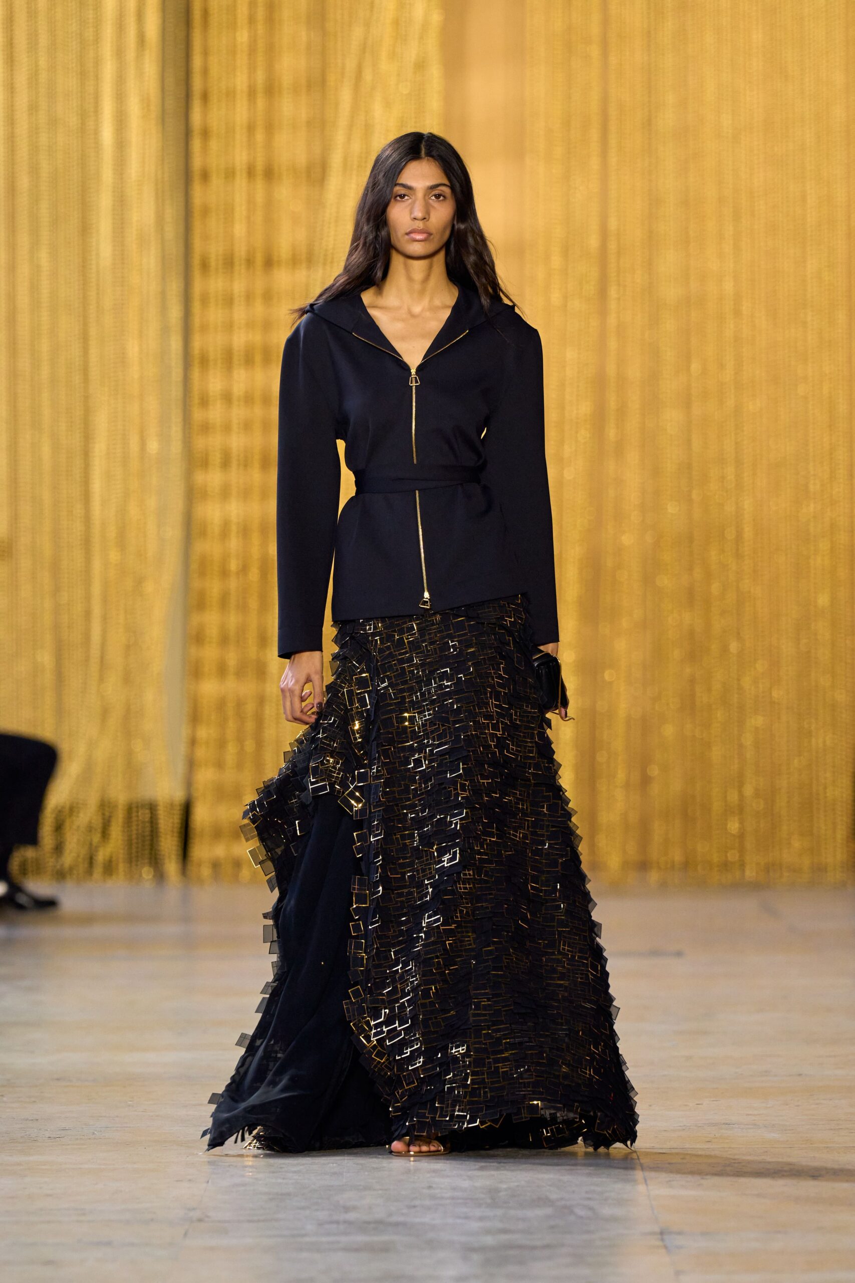 black fitted jacket and layered skirt