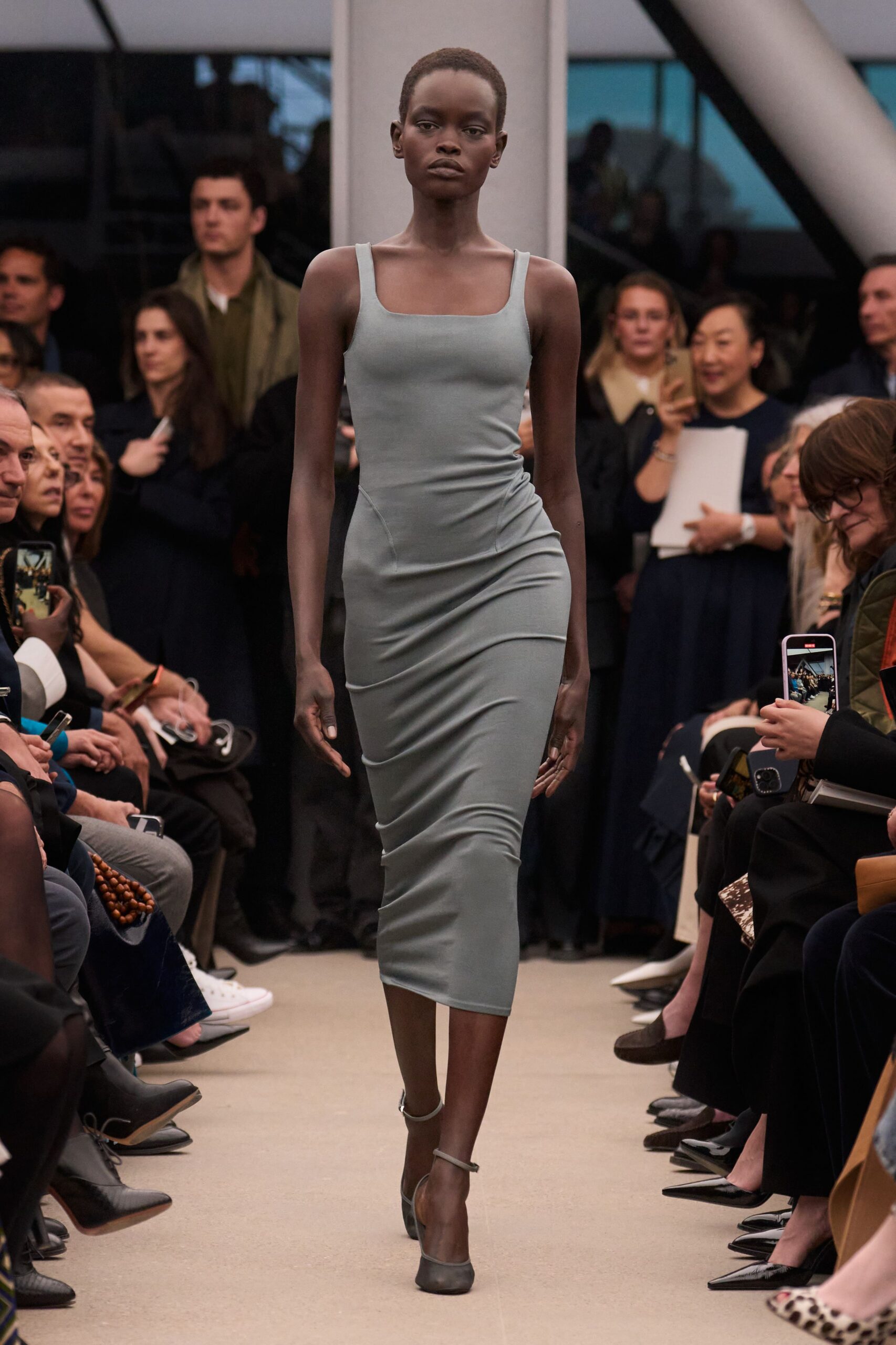 gray fitted midi dress with black shoes