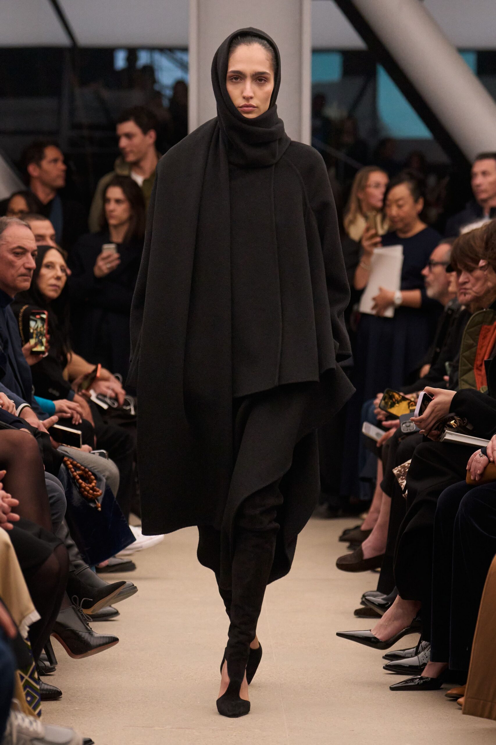 black oversized cape with fitted pants