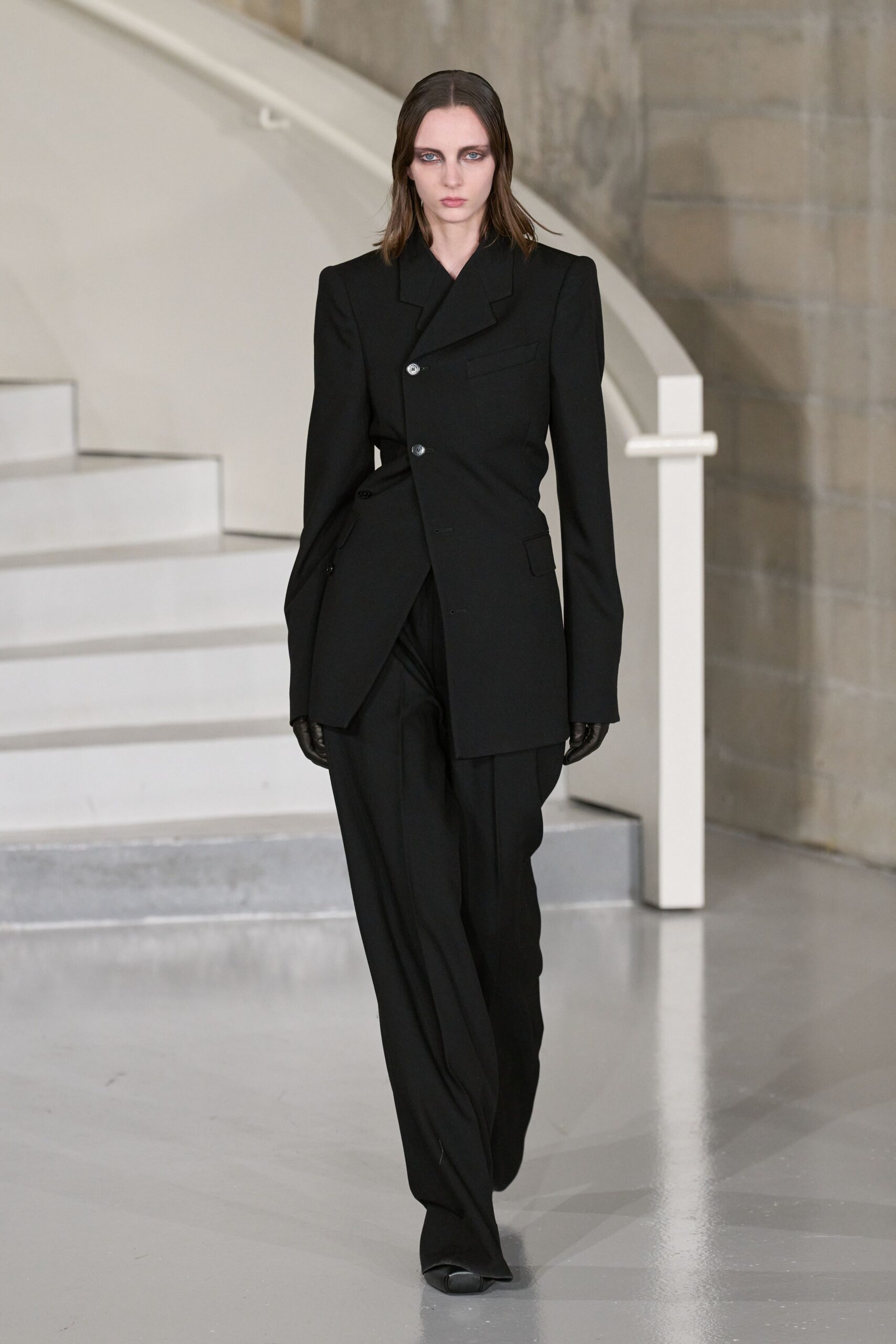 black tailored suit with gloves