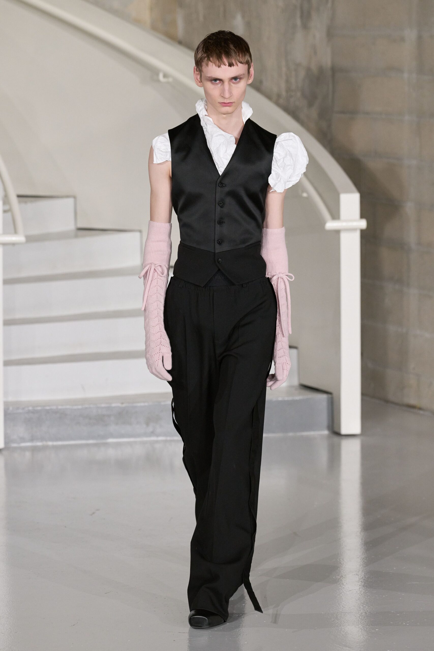 black vest white blouse relaxed pants