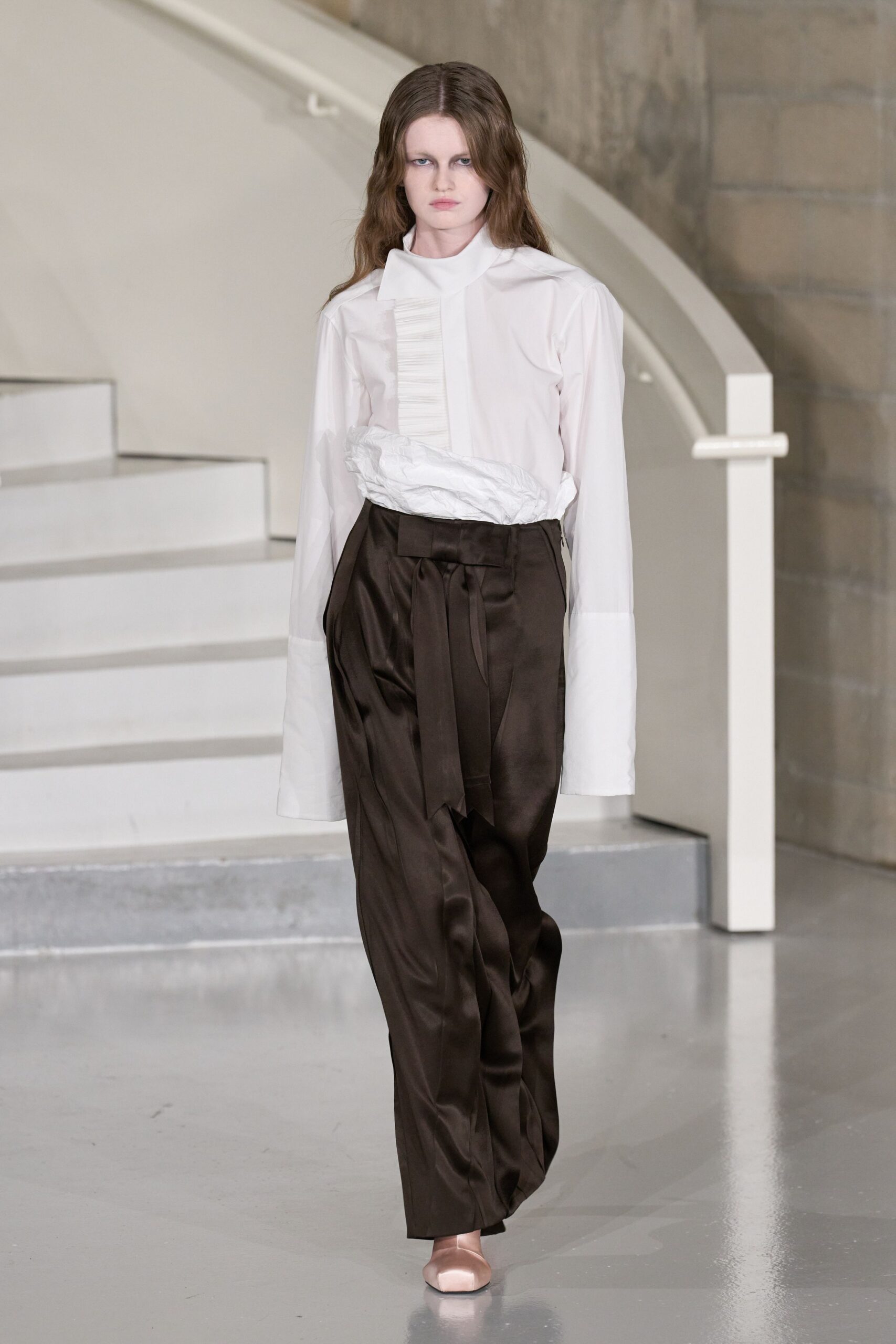 white shirt brown pants pink shoes