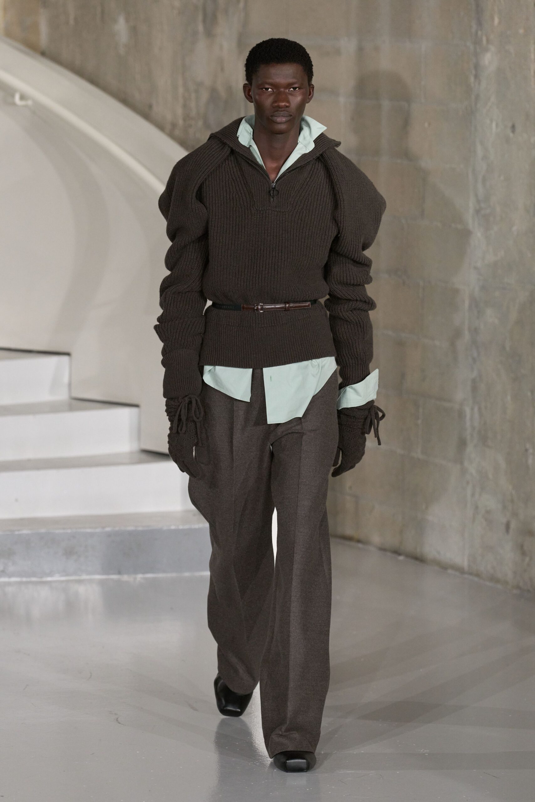 brown relaxed sweater with gray pants