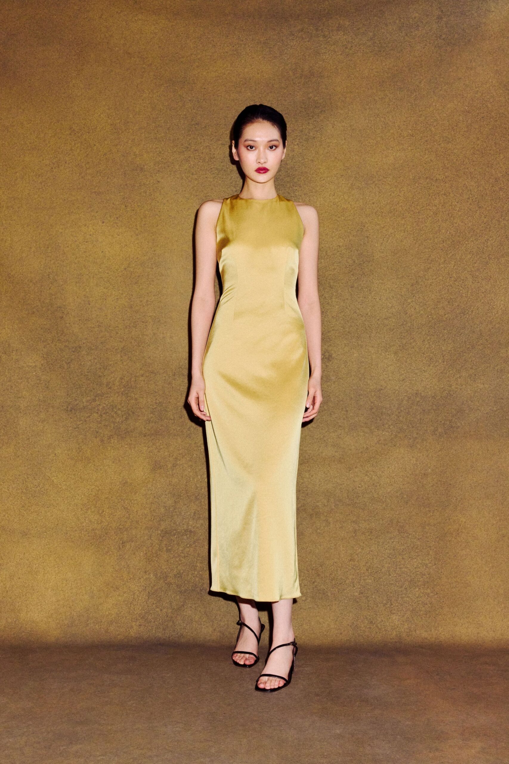 yellow silk sleeveless high-neck fitted shiny midi dress