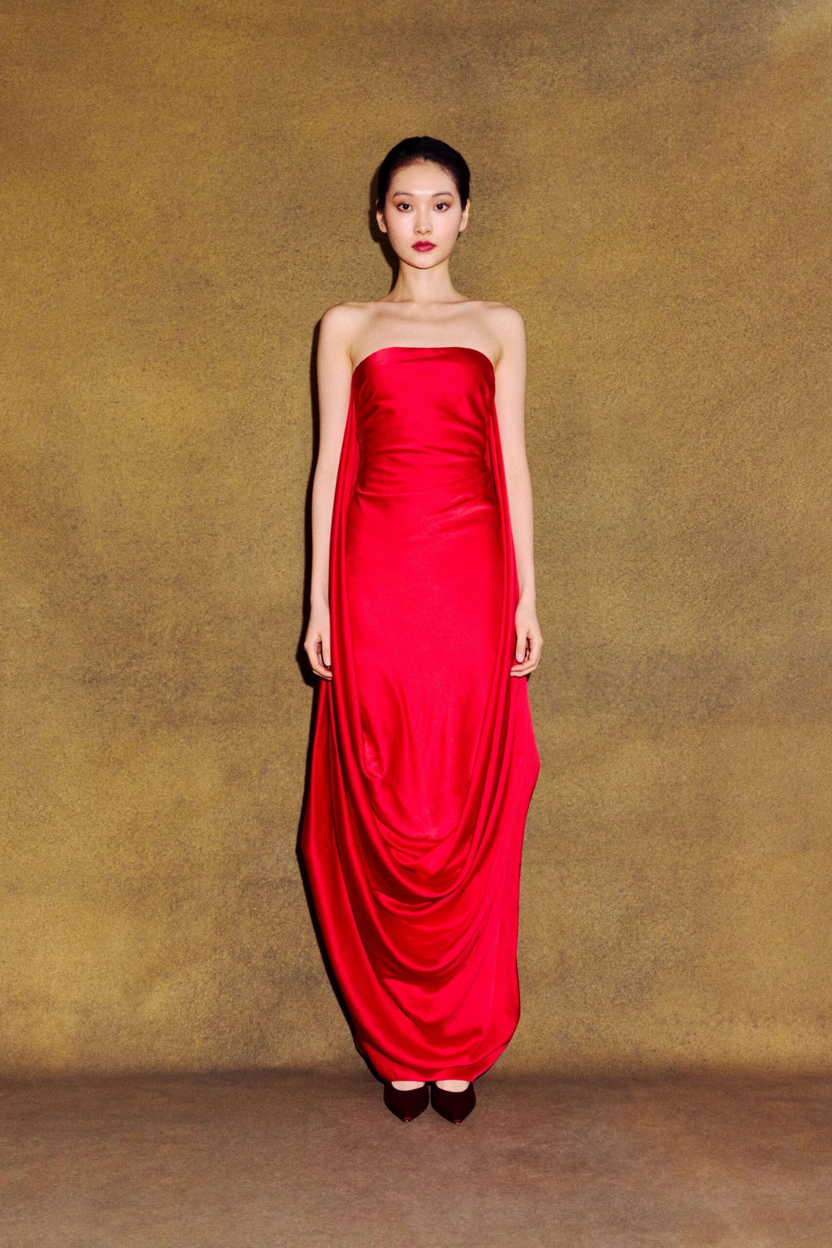 red silk strapless fitted draped flowing maxi gown