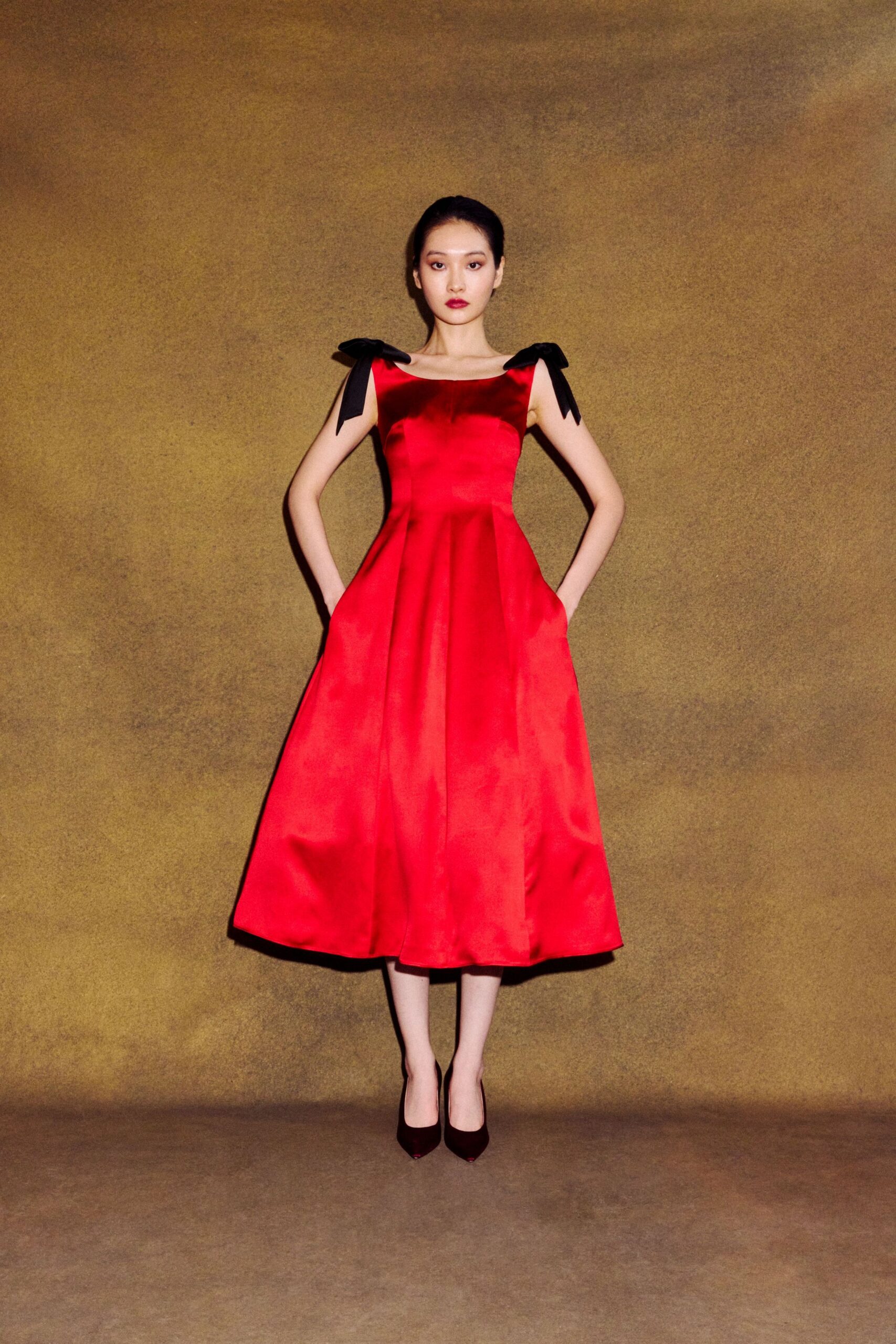 red silk sleeveless square-neck fitted a-line pleated dress