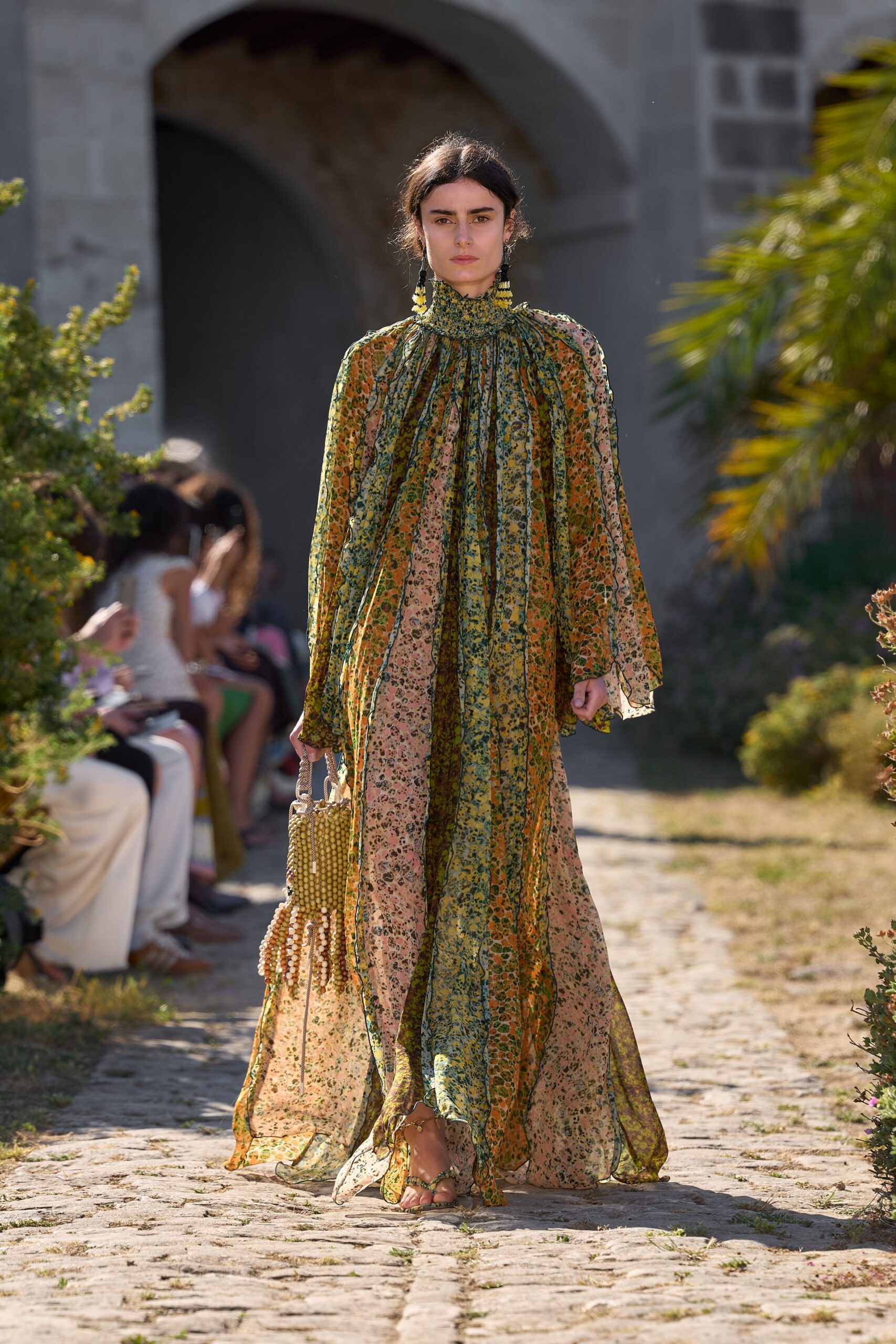 green silk long-sleeve high-neck relaxed floral pleated gown