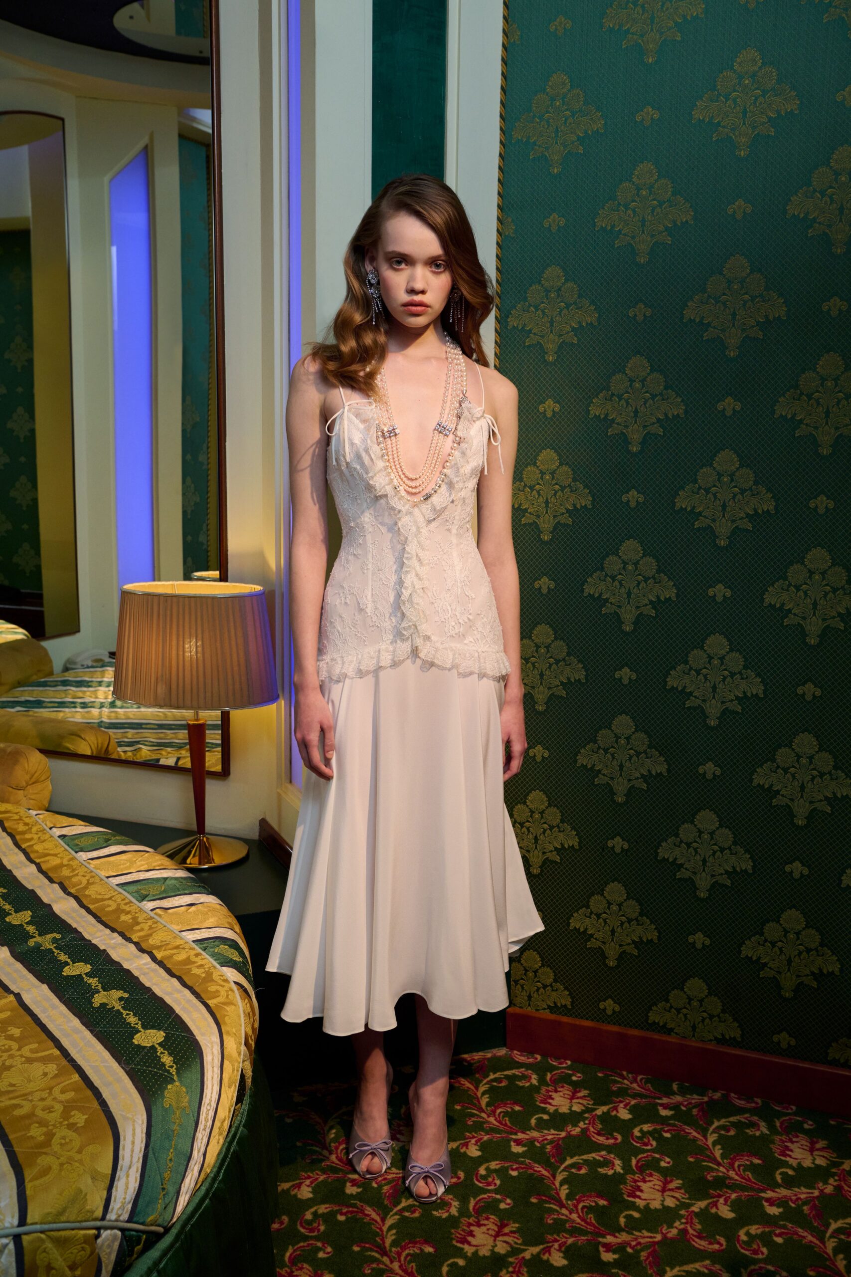 white silk sleeveless v-neck fitted pleated midi dress