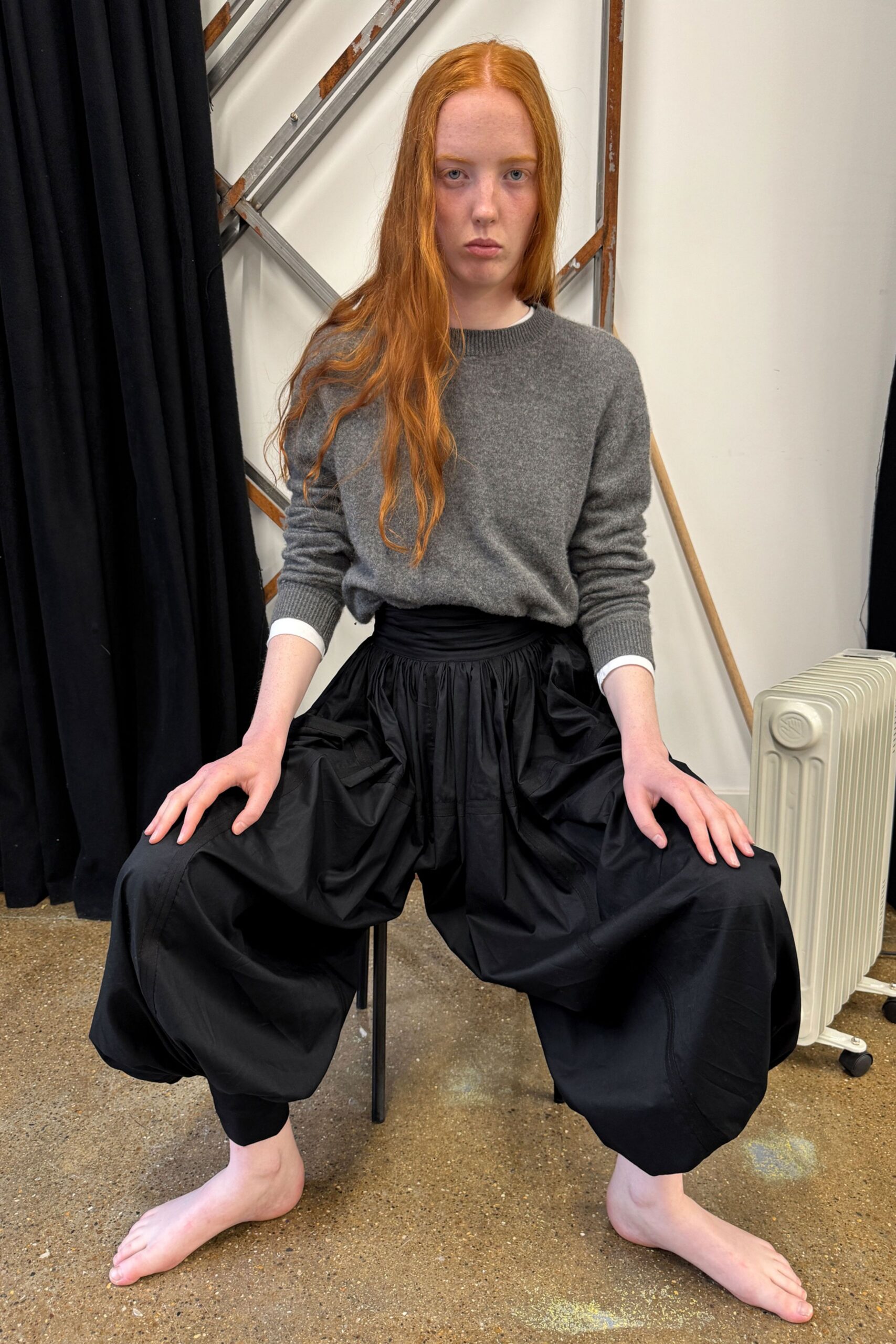 gray wool sweater and black pants