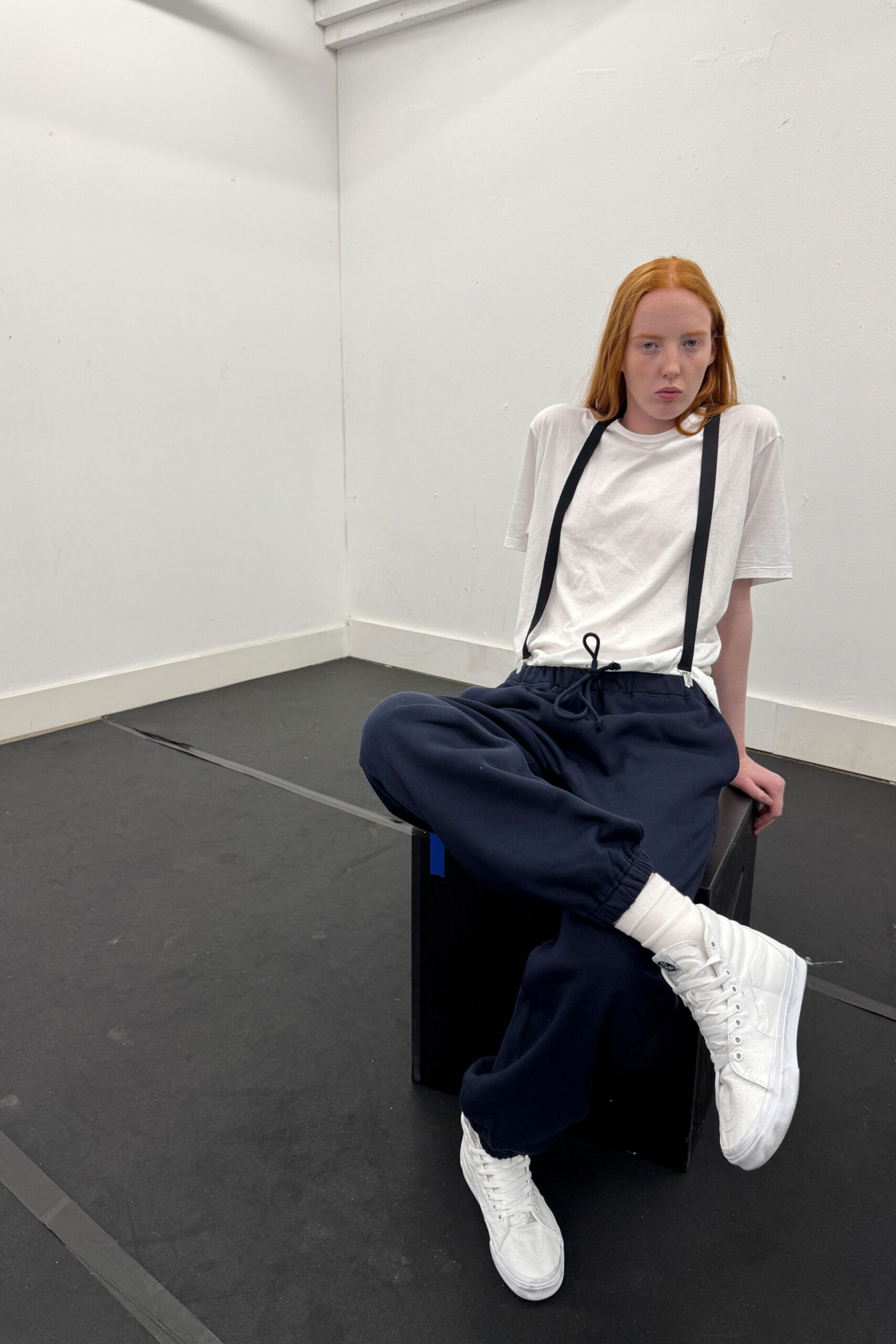 white t-shirt blue pants white shoes