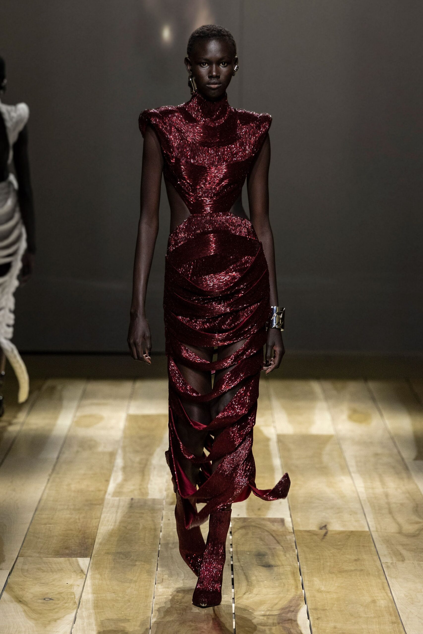 red sequin sleeveless high-neck fitted draped tiered gown