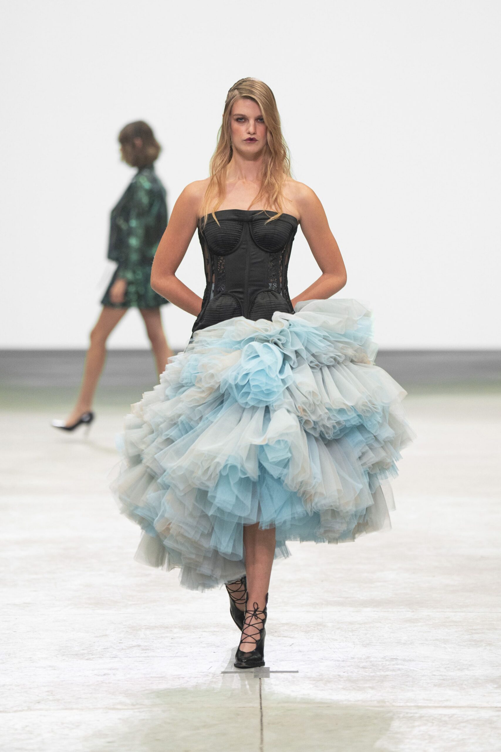 black tulle strapless fitted ruffled tiered flowing gown