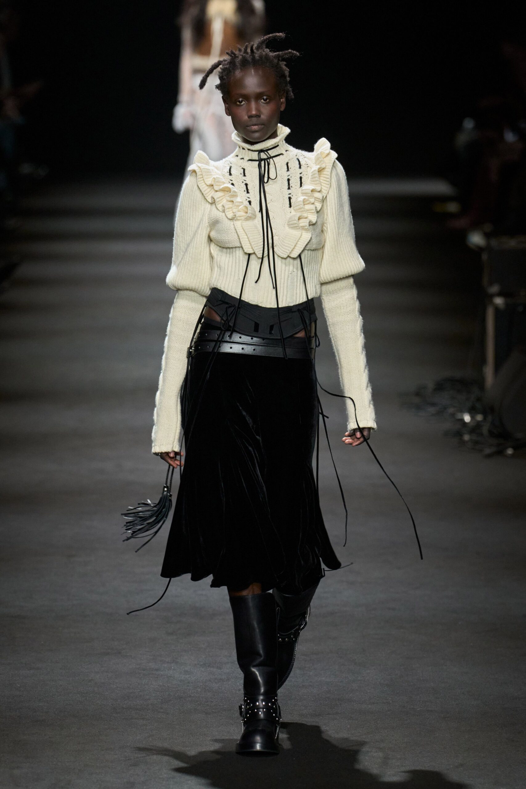 white ruffled top black pleated skirt