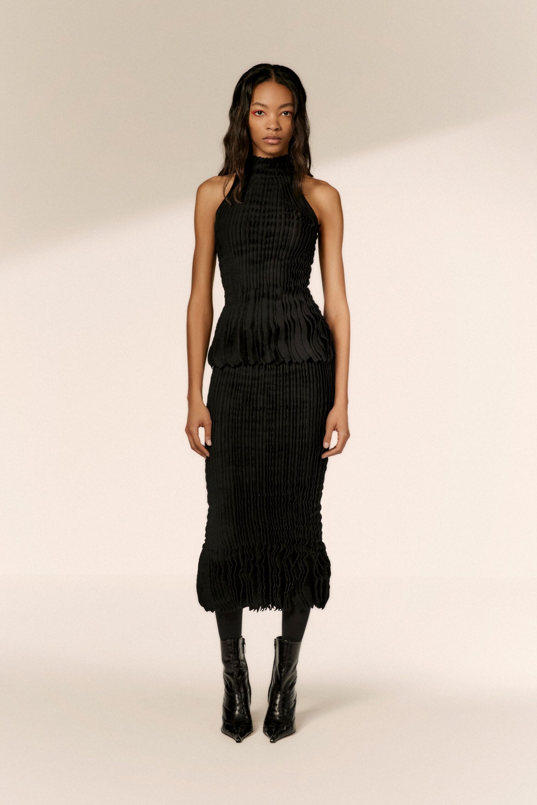 black pleated midi dress with boots