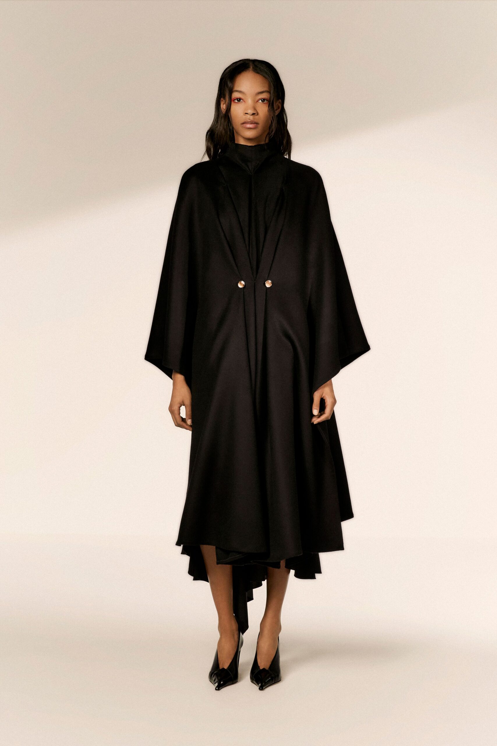 black wool long-sleeve collared relaxed buttoned draped cape