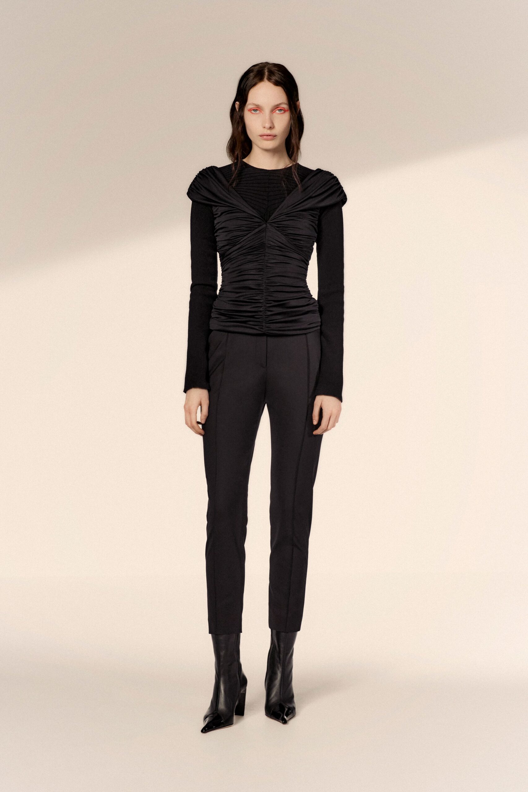 black fitted top and slim pants
