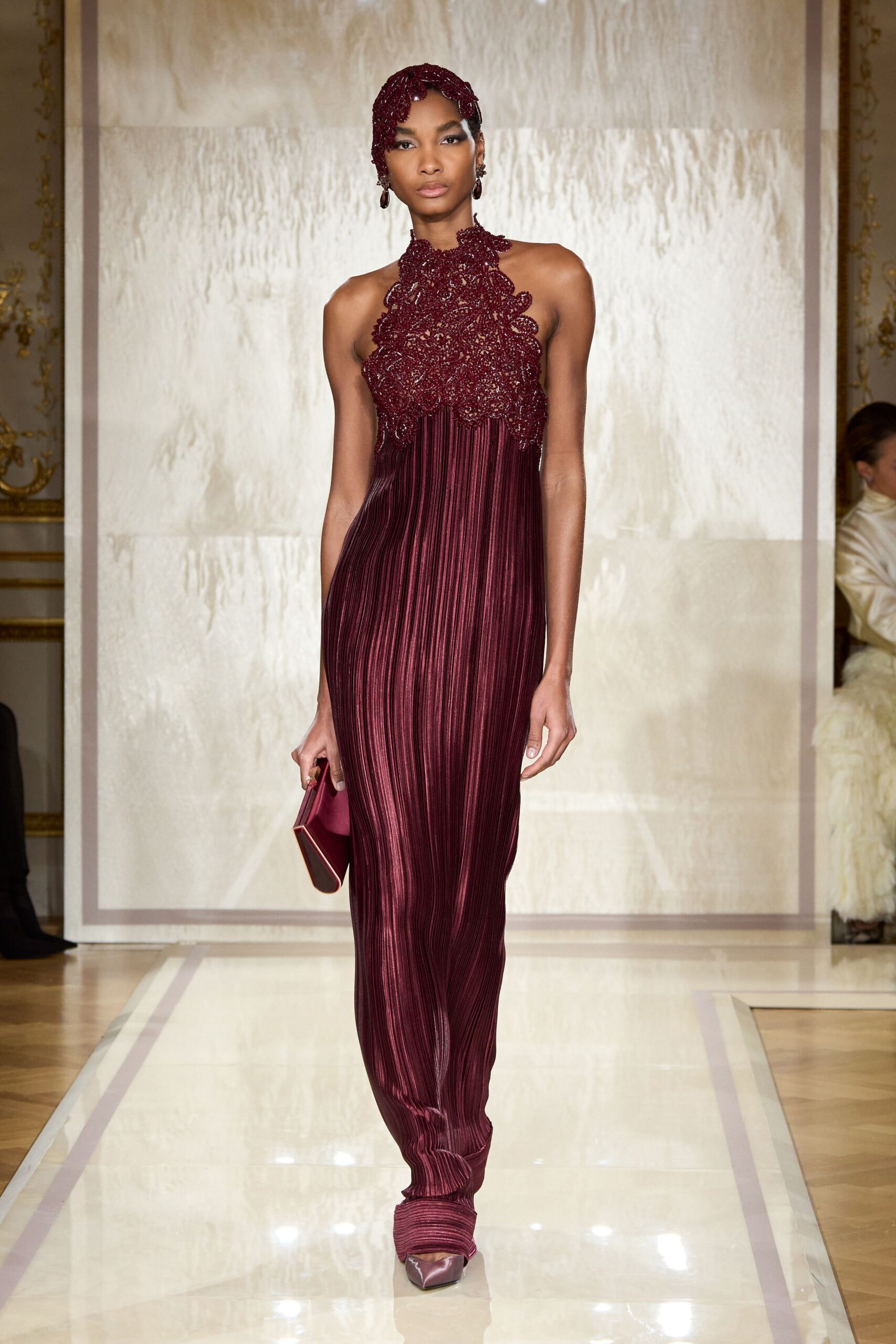 red silk sleeveless high-neck fitted pleated embellished gown