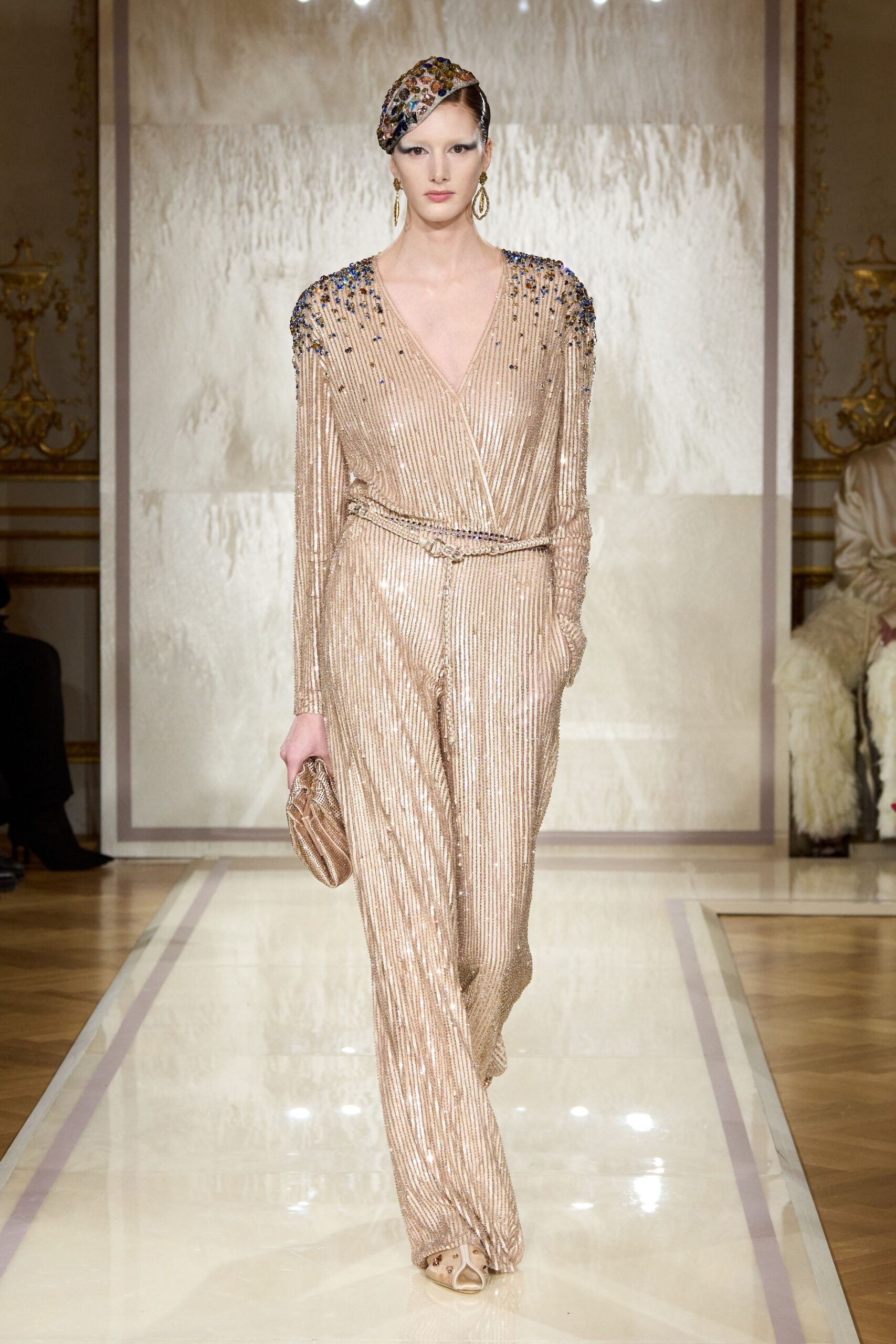 gold silk long-sleeve v-neck fitted pleated belted jumpsuit