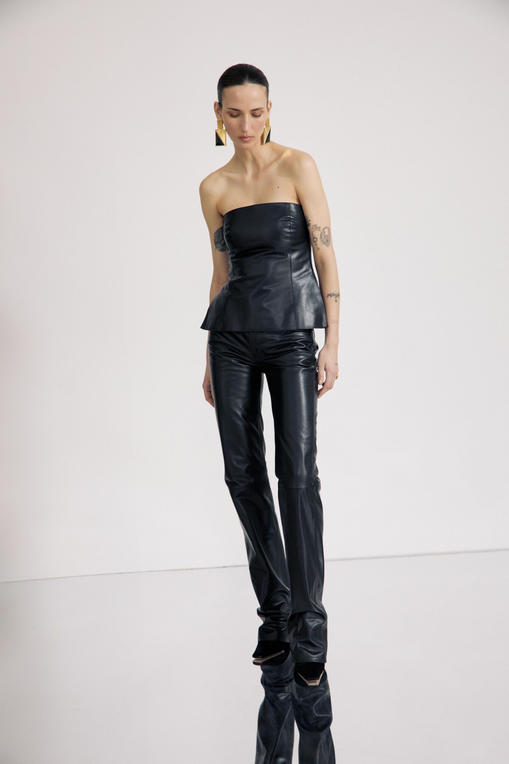 black leather strapless top and fitted pants