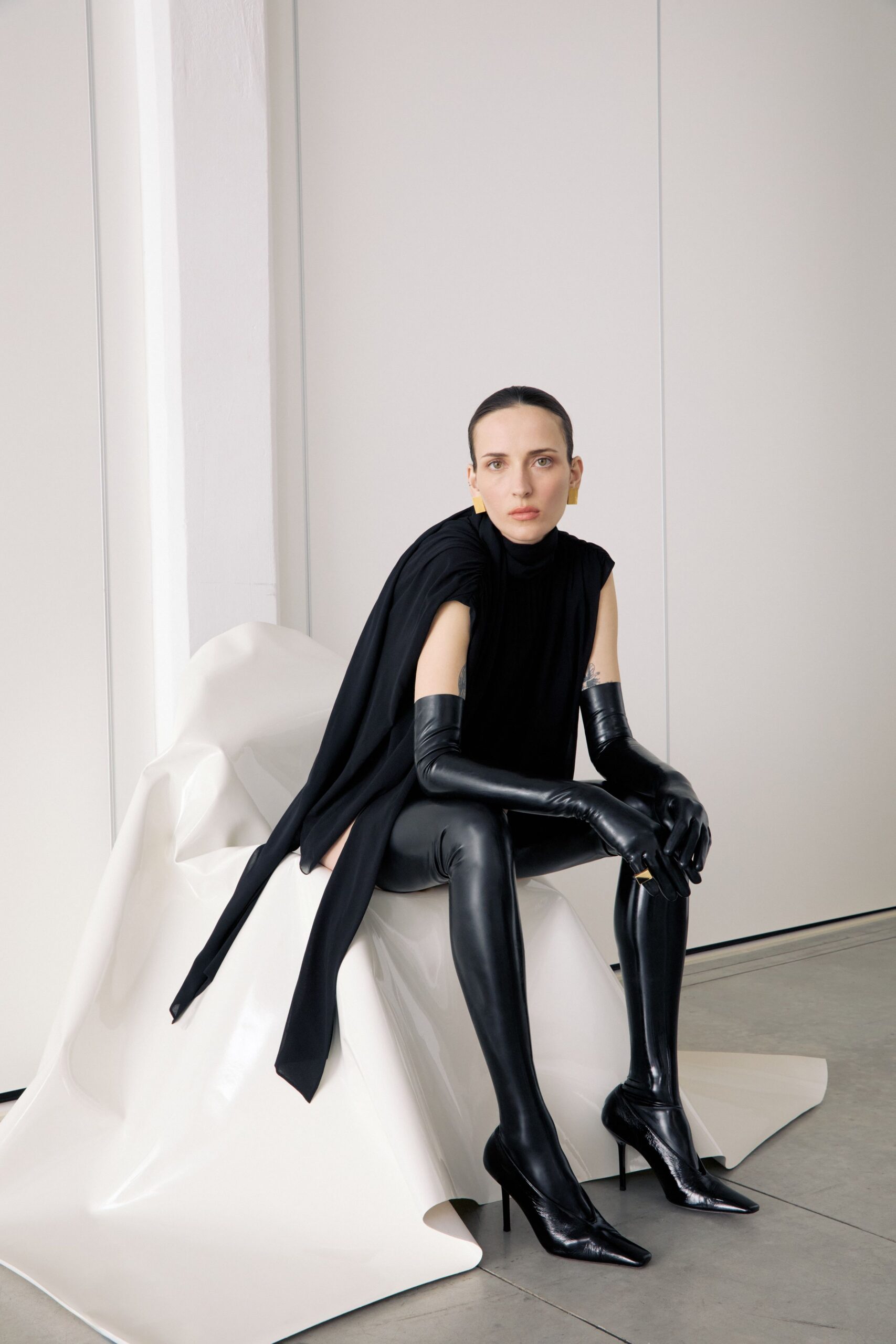 black fitted top and leather pants
